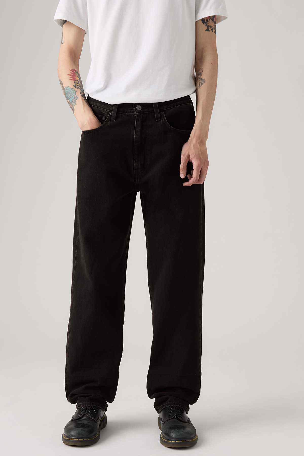 Black jeans close-up with front pockets and relaxed waistband