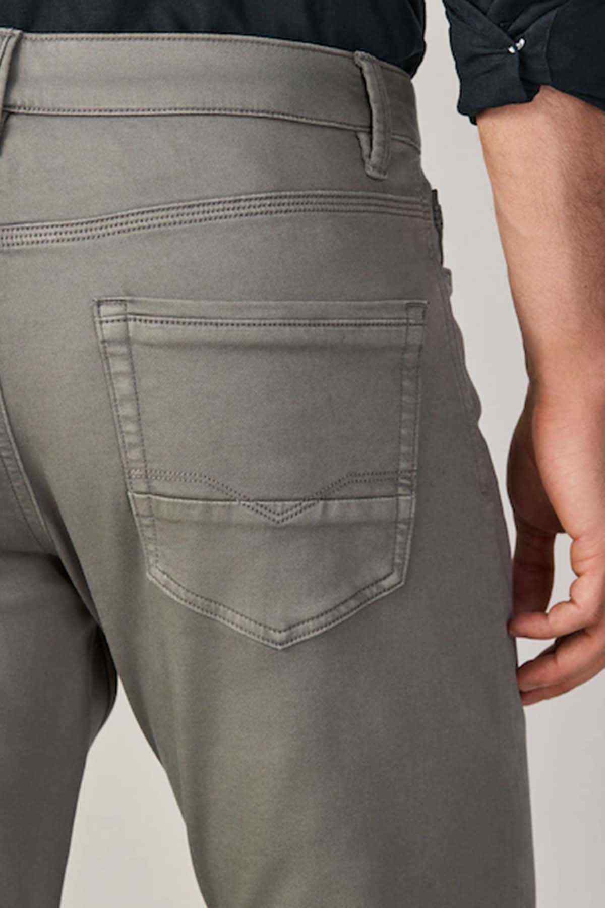 Taupe brown trousers with stitched back pocket and curved front pocket seams