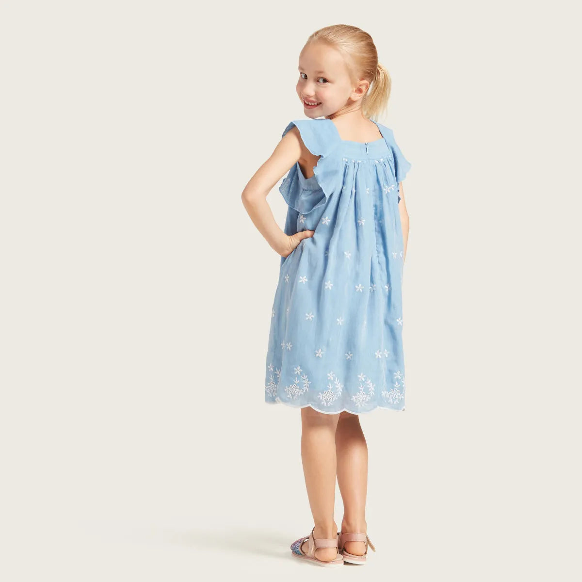 Blue baby dress with star print, square neckline, ruffled sleeves, gathered skirt