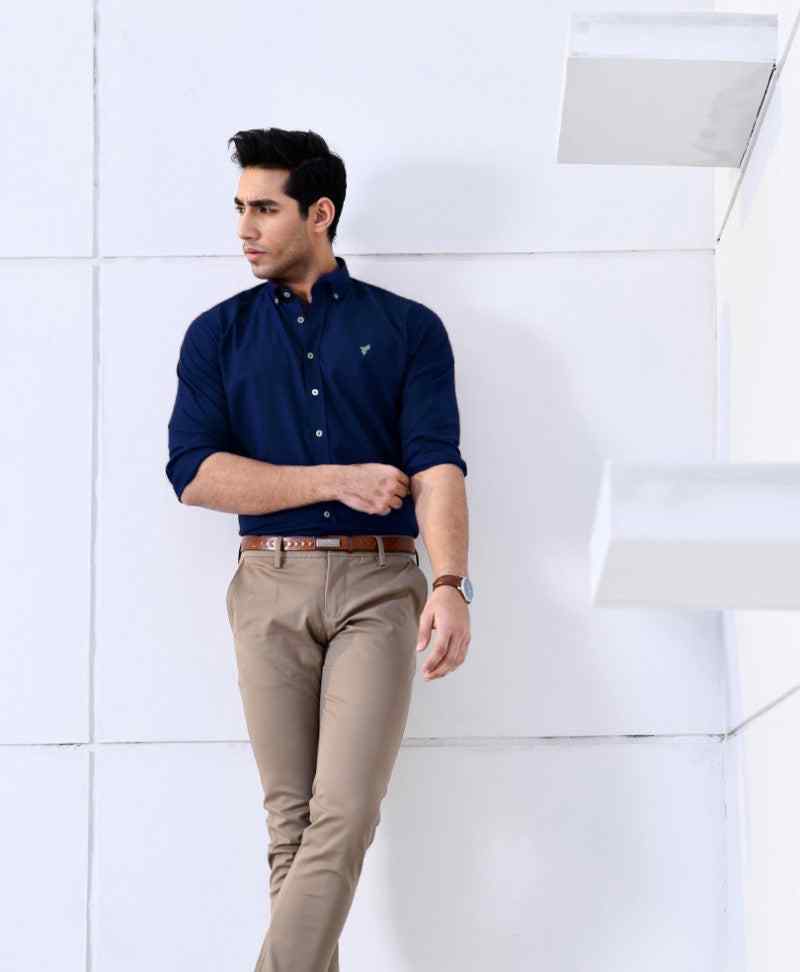 Blue fitted button-up shirt with collar, button front, and small chest logo