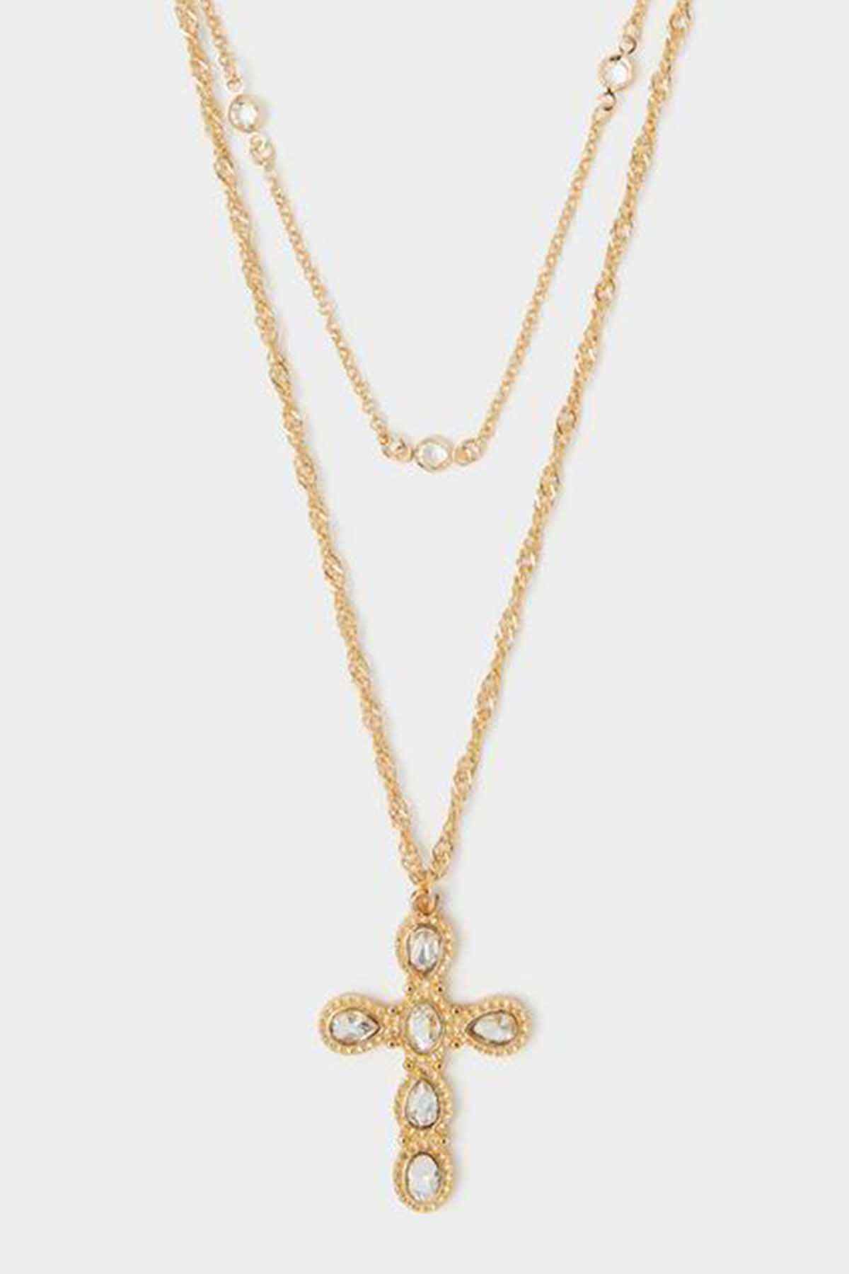 Accessorize crystal cross necklace with layered gold-tone chains and crystal-studded cross