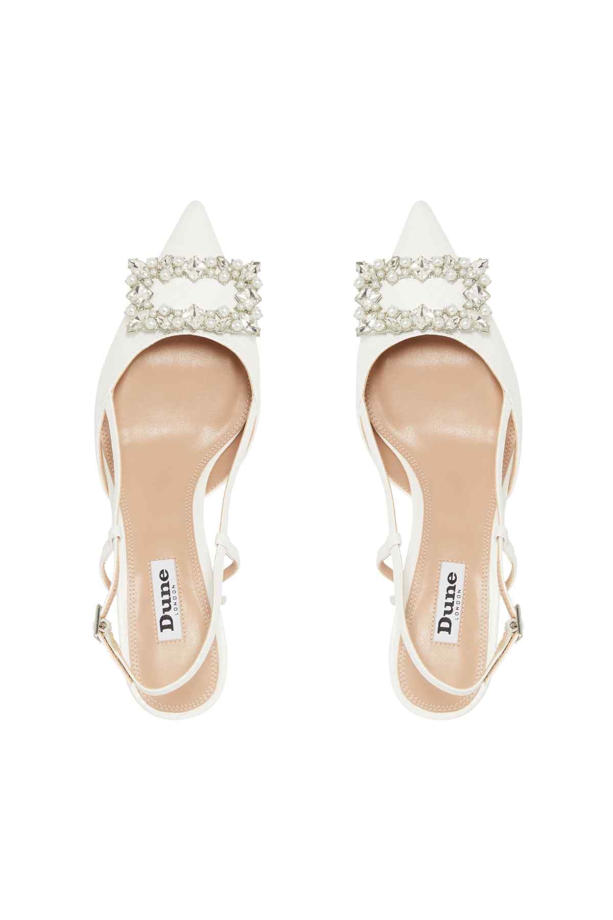 Pair of white Dune London heels with pearl-and-rhinestone ankle strap embellishment