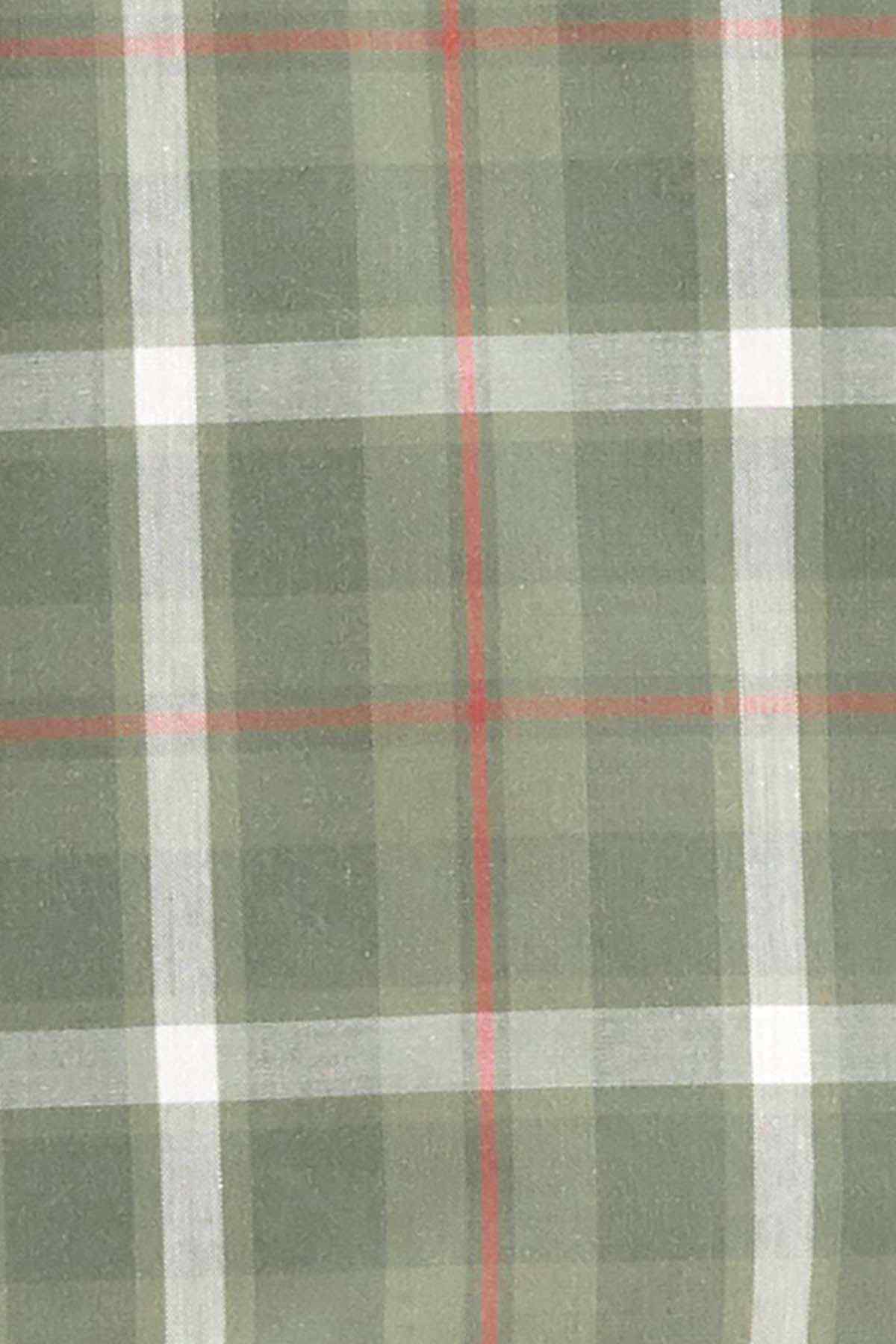 Green plaid fabric with red and white stripes, button-shirt material close-up