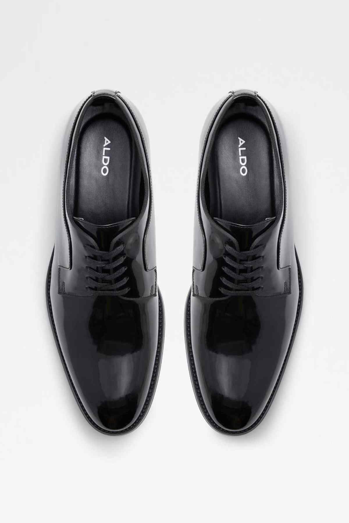 Pair of black leather lace-up oxford shoes with ALDO branding on inner lining