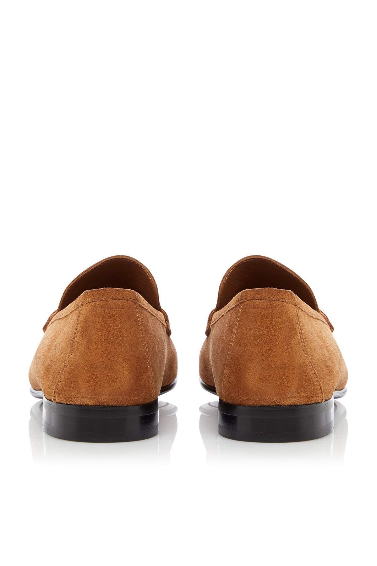 Tan suede loafers, back view with low heel and dark rubber sole