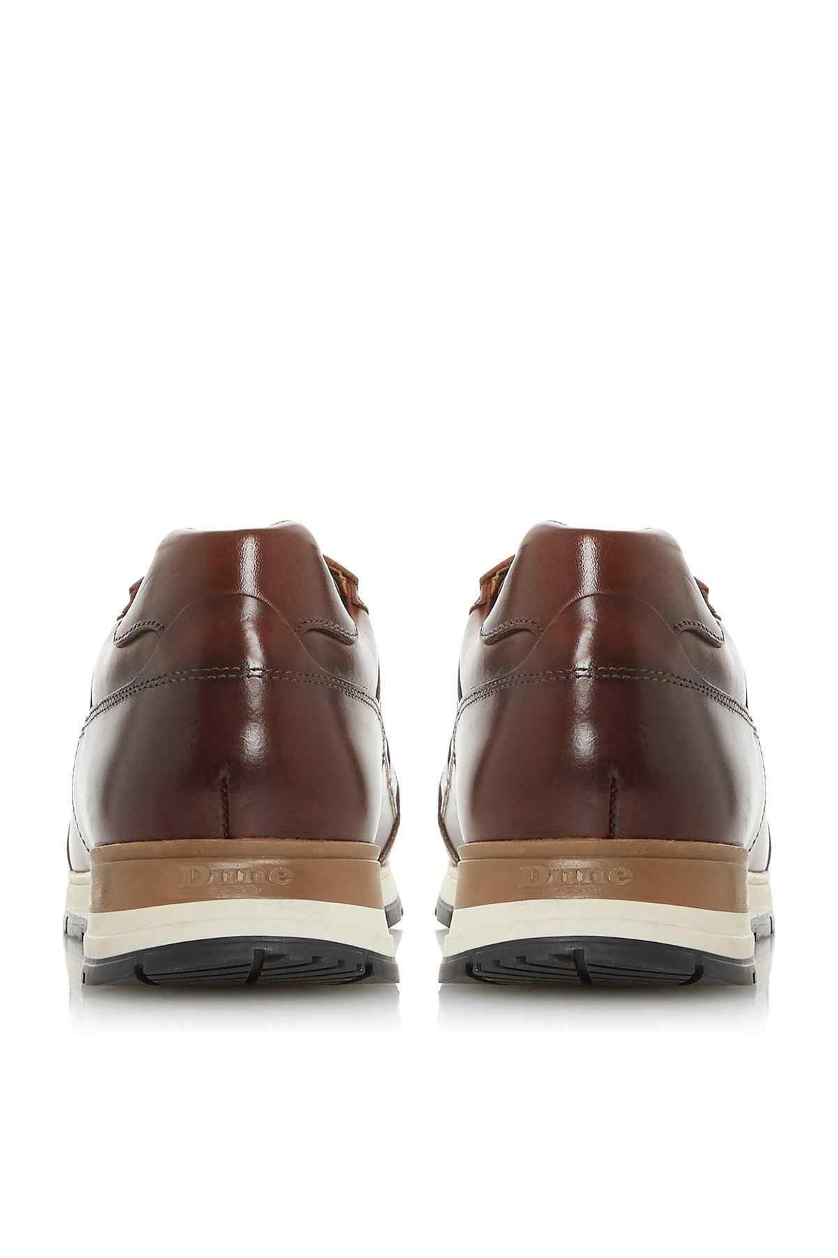 Brown leather sneakers, back view with cream heel panel and treaded sole