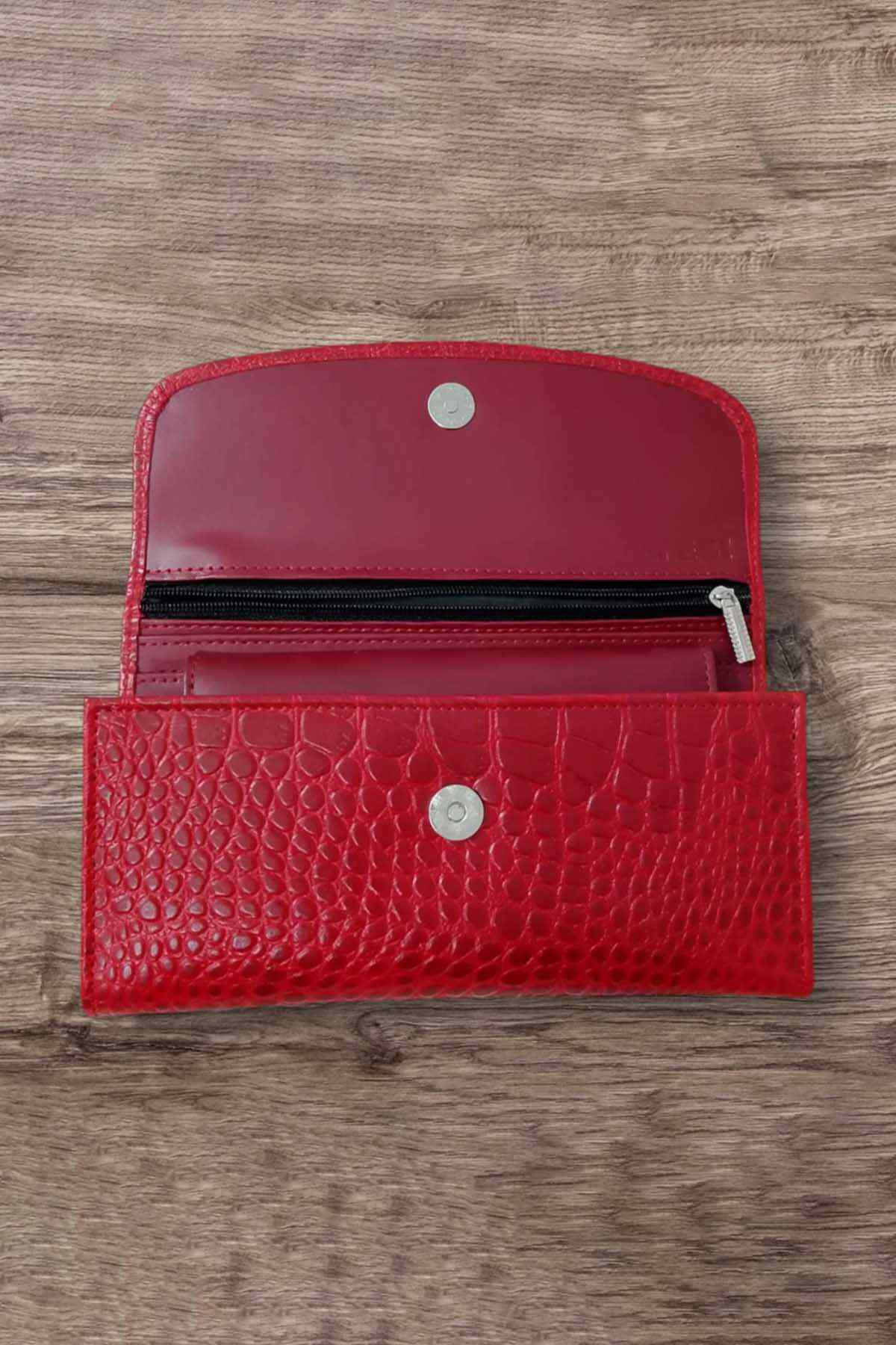 Red leather wallet front with snap closure and textured finish