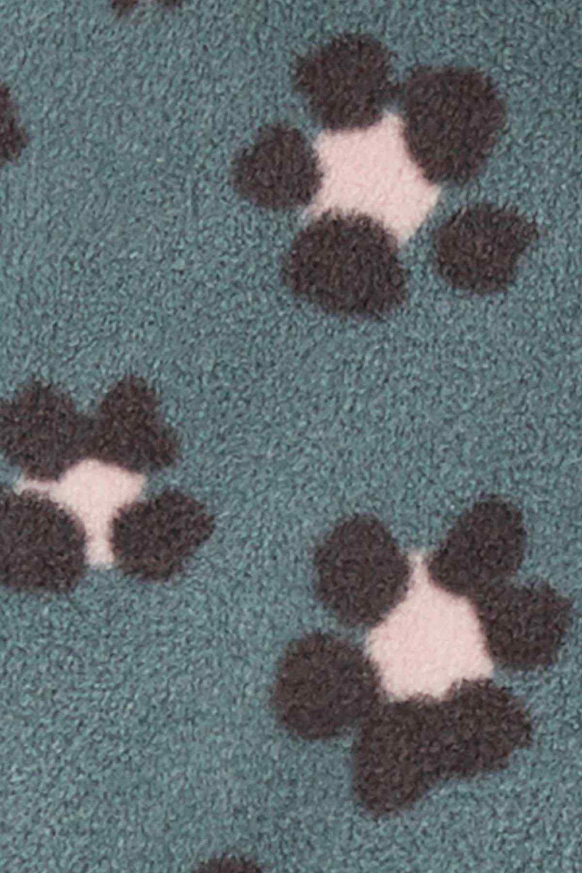 Teal fabric with brown and light paw-print motifs, close-up