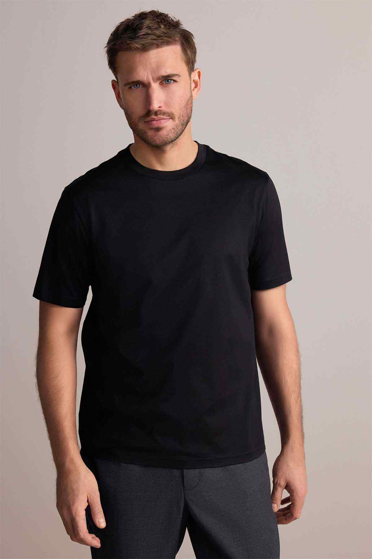 Next black crew-neck short-sleeve T-shirt on model, front view