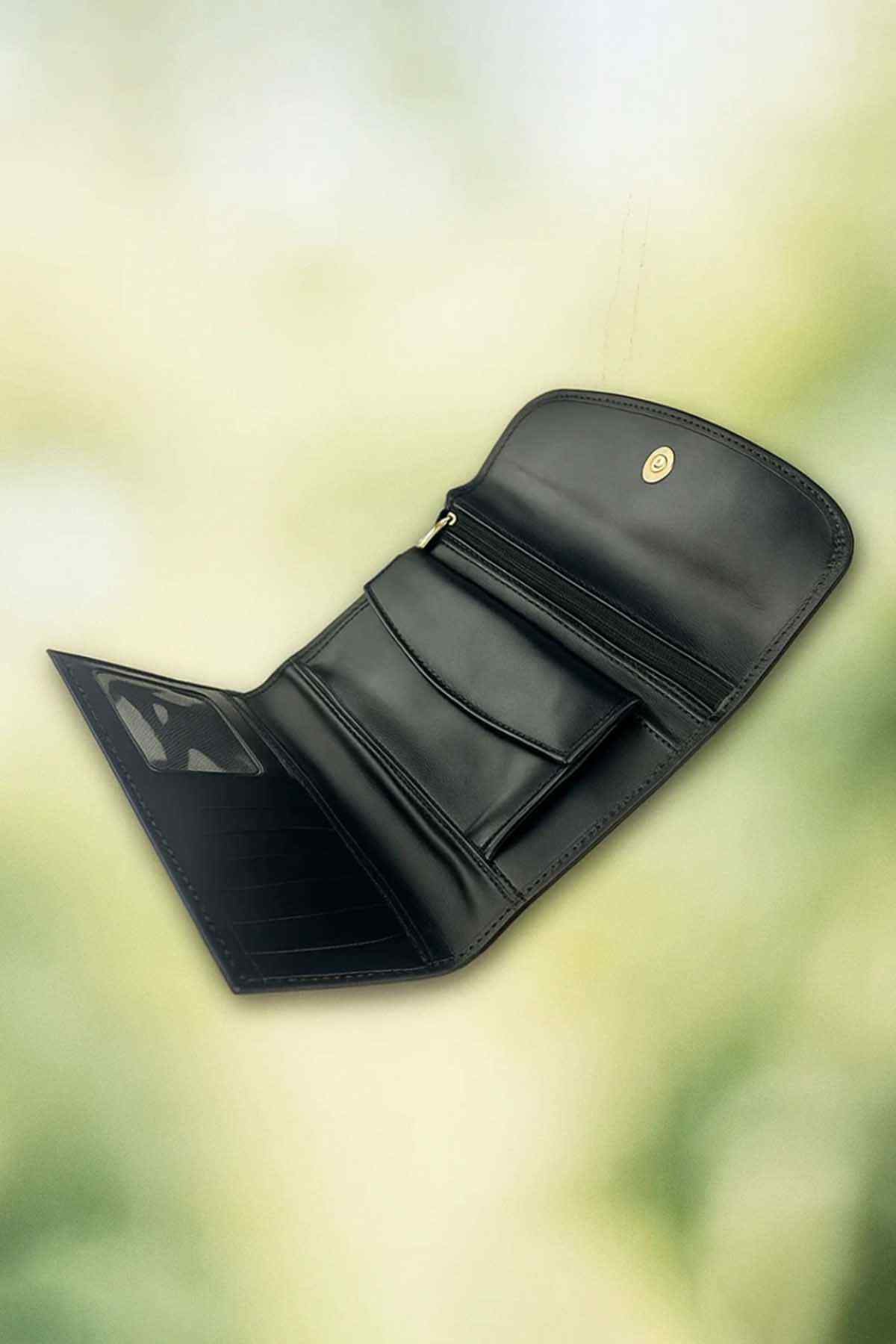 Black leather wallet open flat with multiple card slots and inner pockets