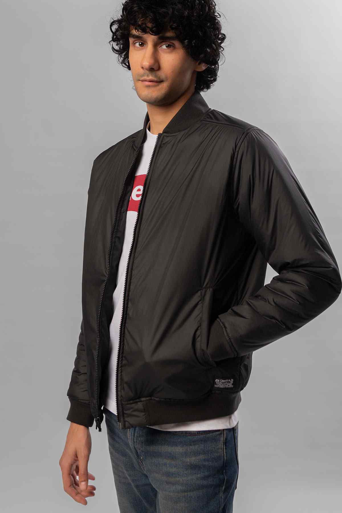 Levi's black bomber jacket side view with zip front and ribbed cuffs