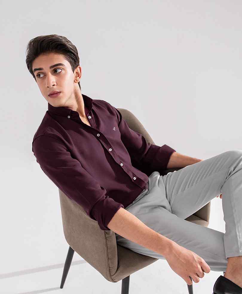 Fitted maroon button-up shirt, long sleeves, button front, chest logo