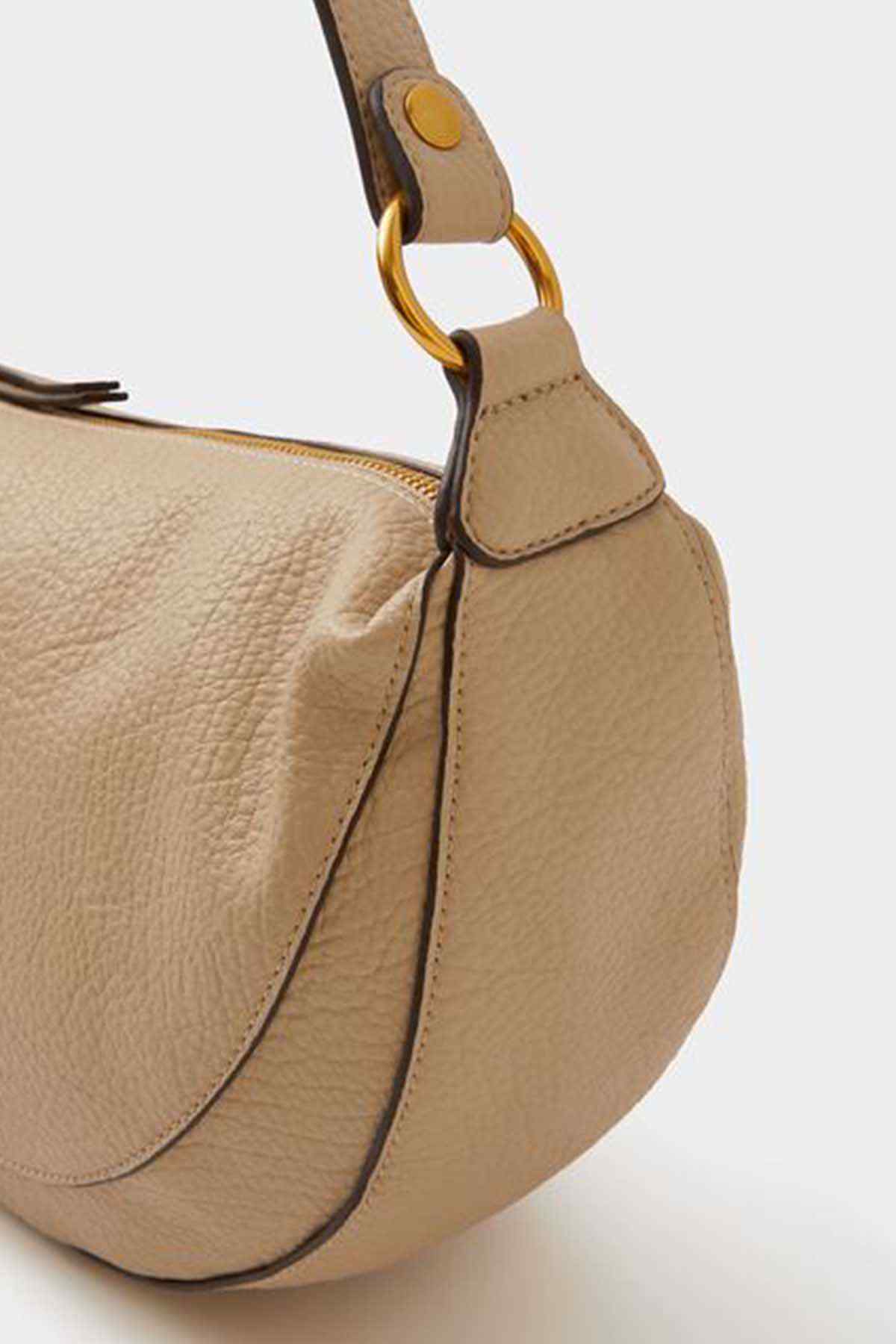 Accessorize mink leather-look bag with ring handle detail and side seam