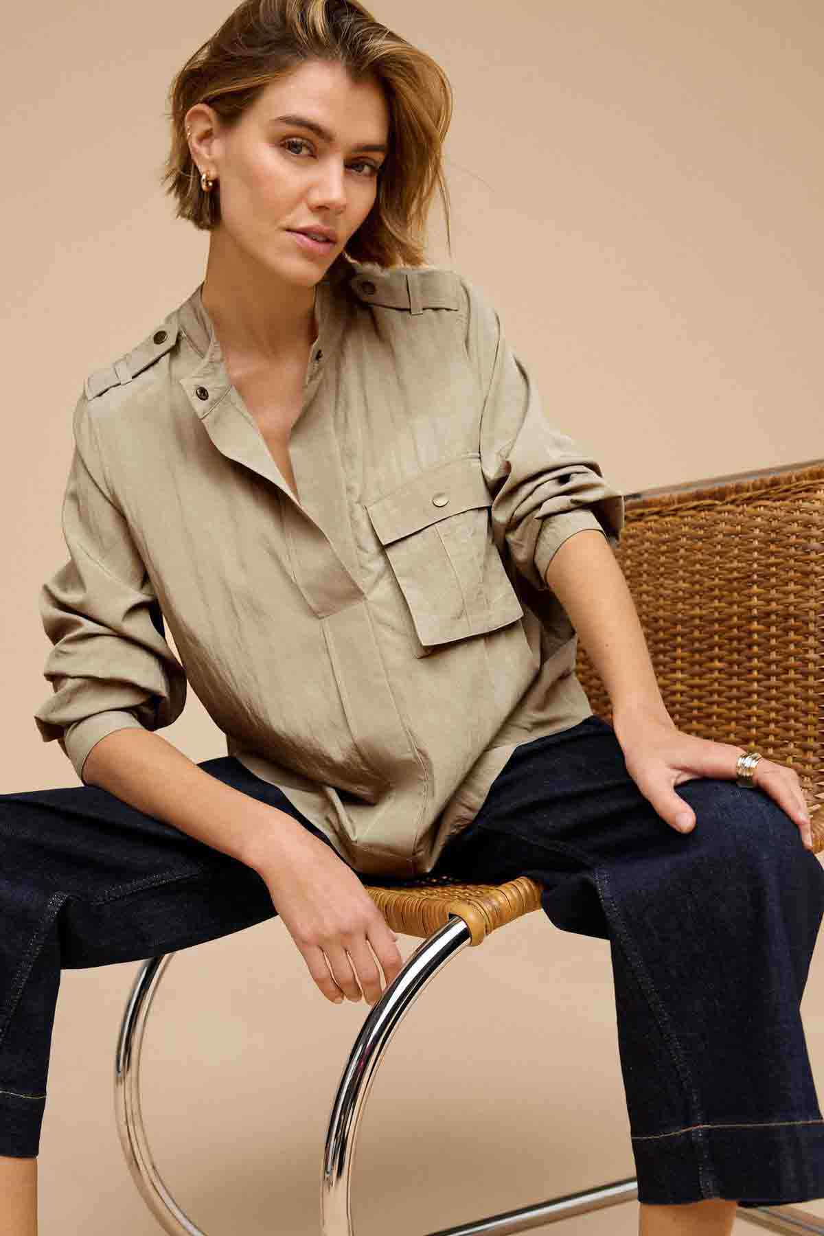 Khaki green button-front utility jacket with chest flap pockets