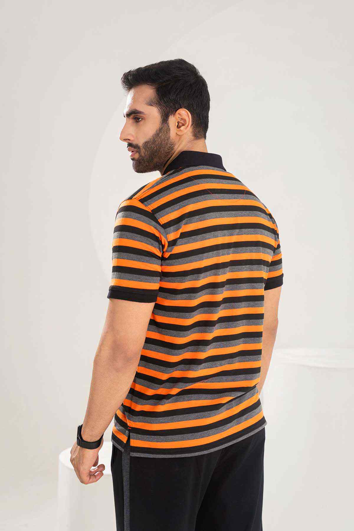 Orange and black striped polo shirt, short sleeves, back view close
