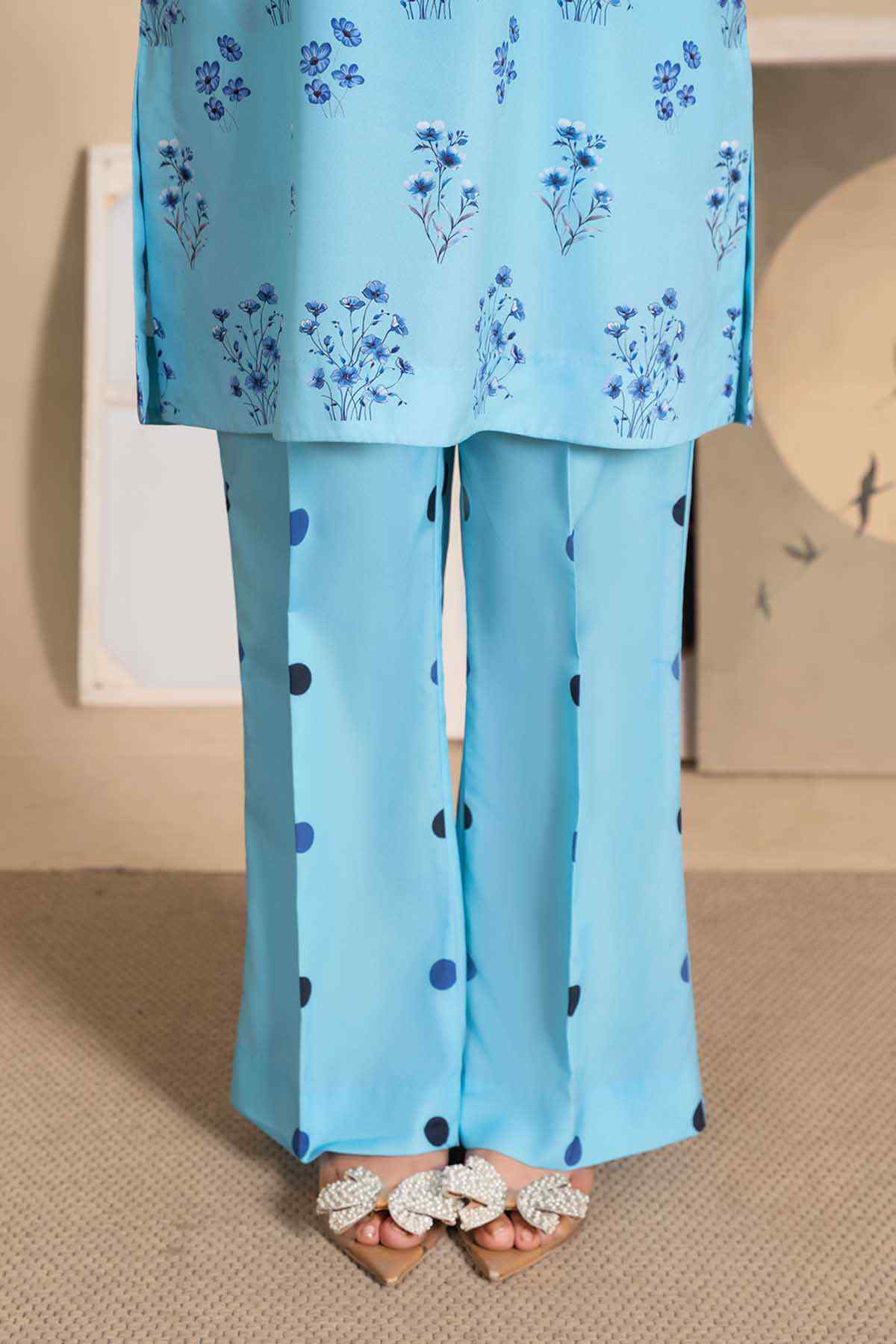 Light blue dot-pattern palazzo pants with floral kurta hem overlay