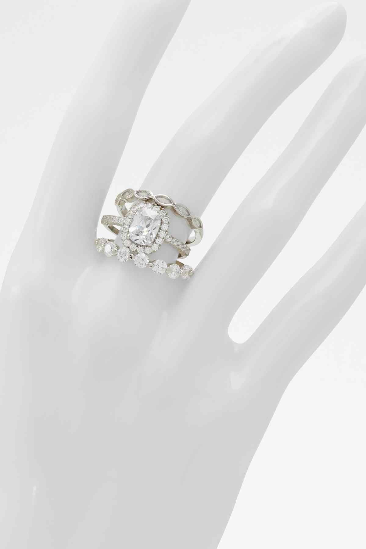 Silver-tone rhinestone ring with large round center stone and side clusters