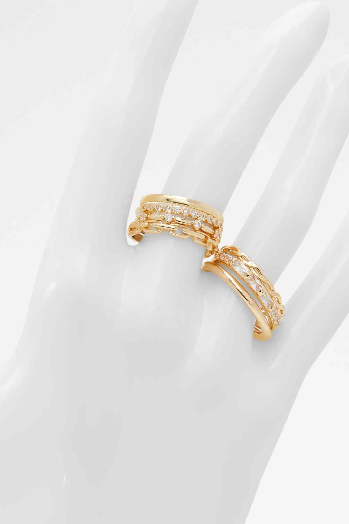 Gold-tone chain-link ring set with clear stones, stacked on finger