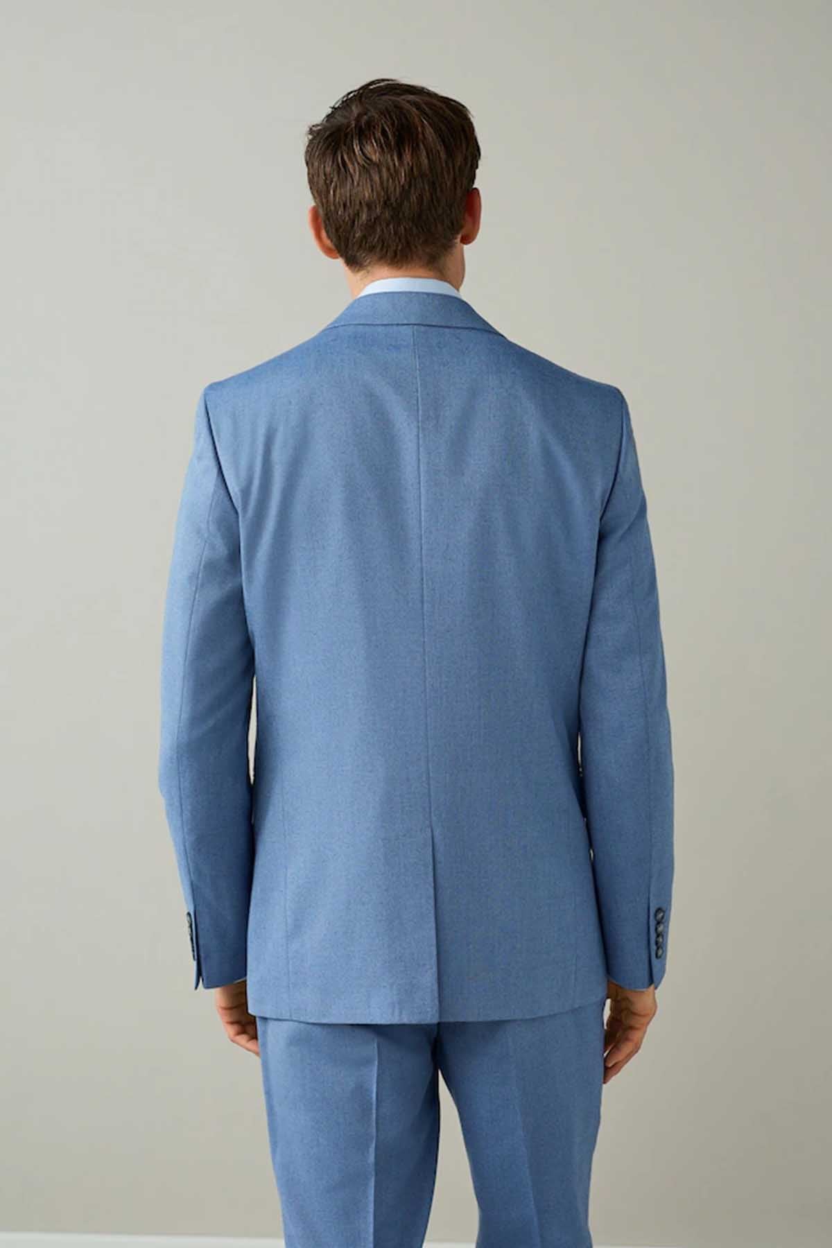 Men's chambray blue suit jacket and trousers, back view