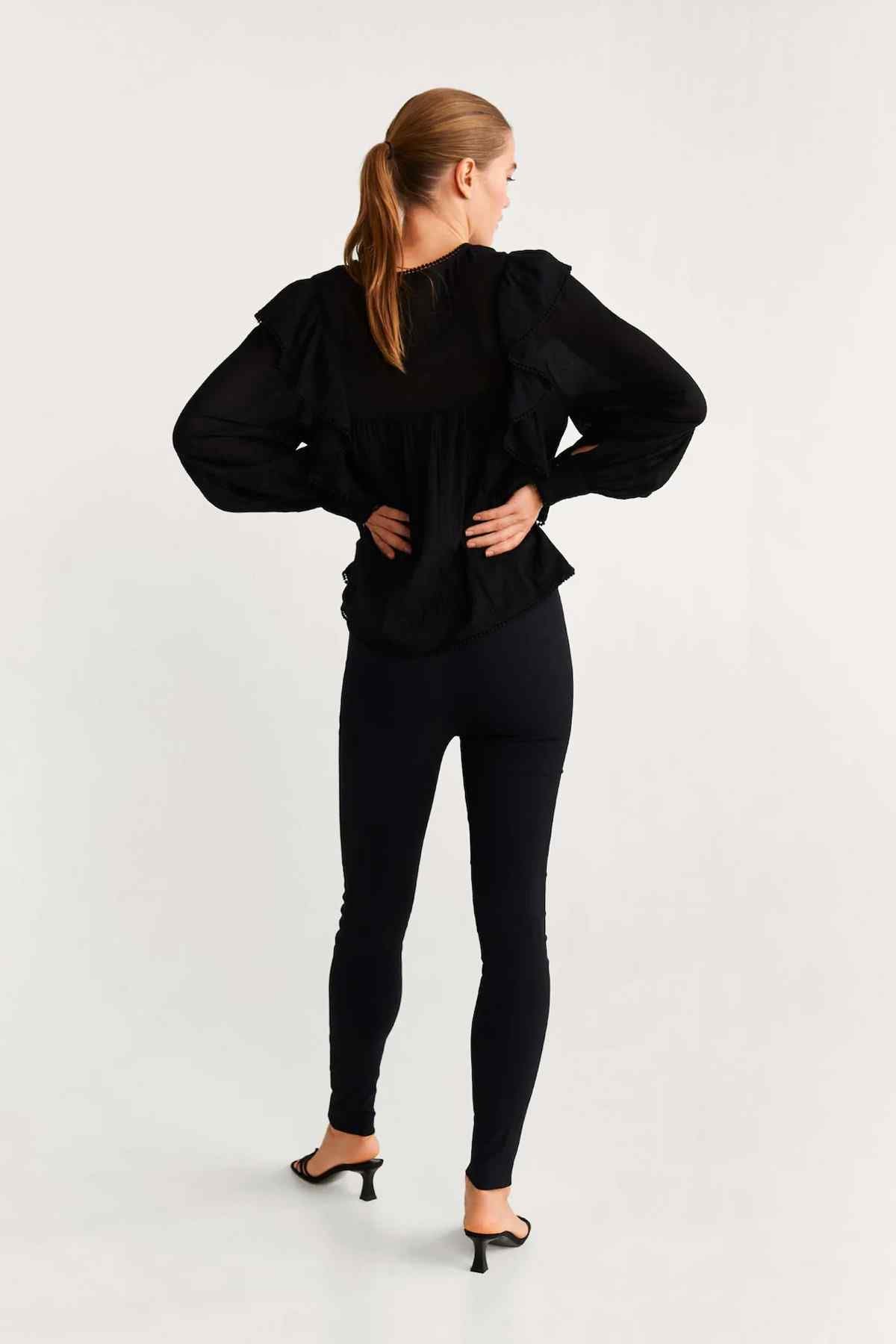 Black blouse back view with gathered shoulders and long puff sleeves