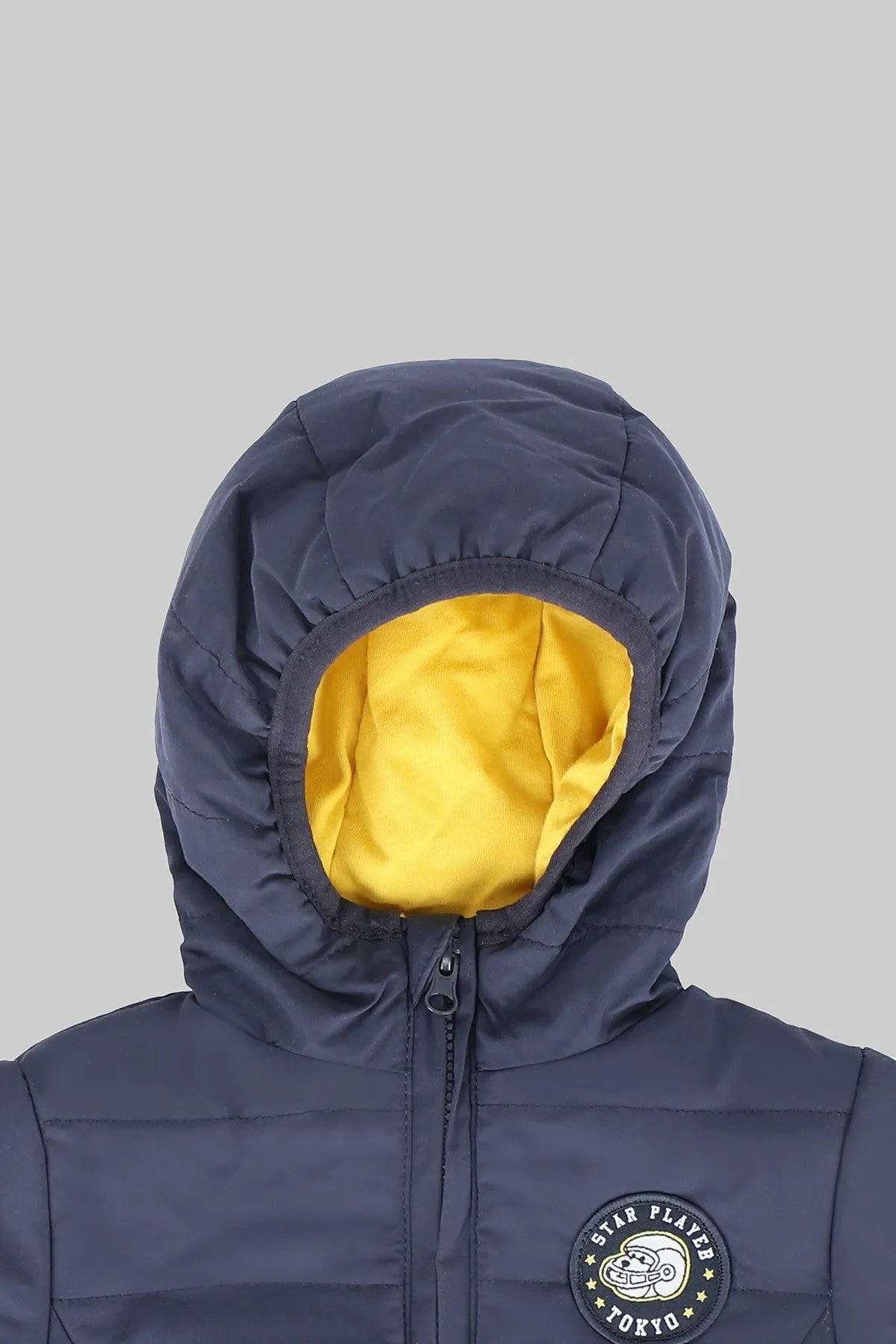 Kids' blue hooded puffer jacket with yellow inner lining and front logo badge