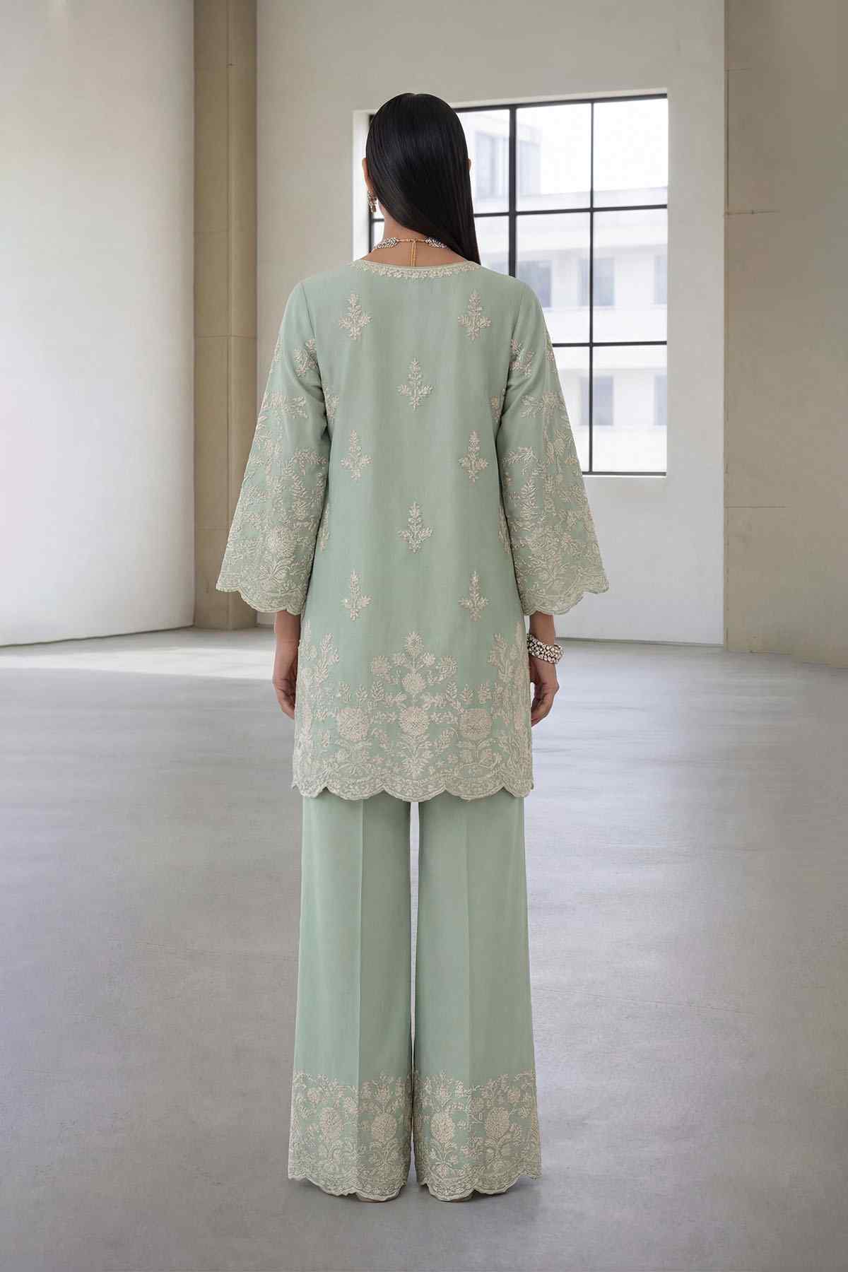 Light green embroidered kurta set with back yoke detailing and wide-leg trousers