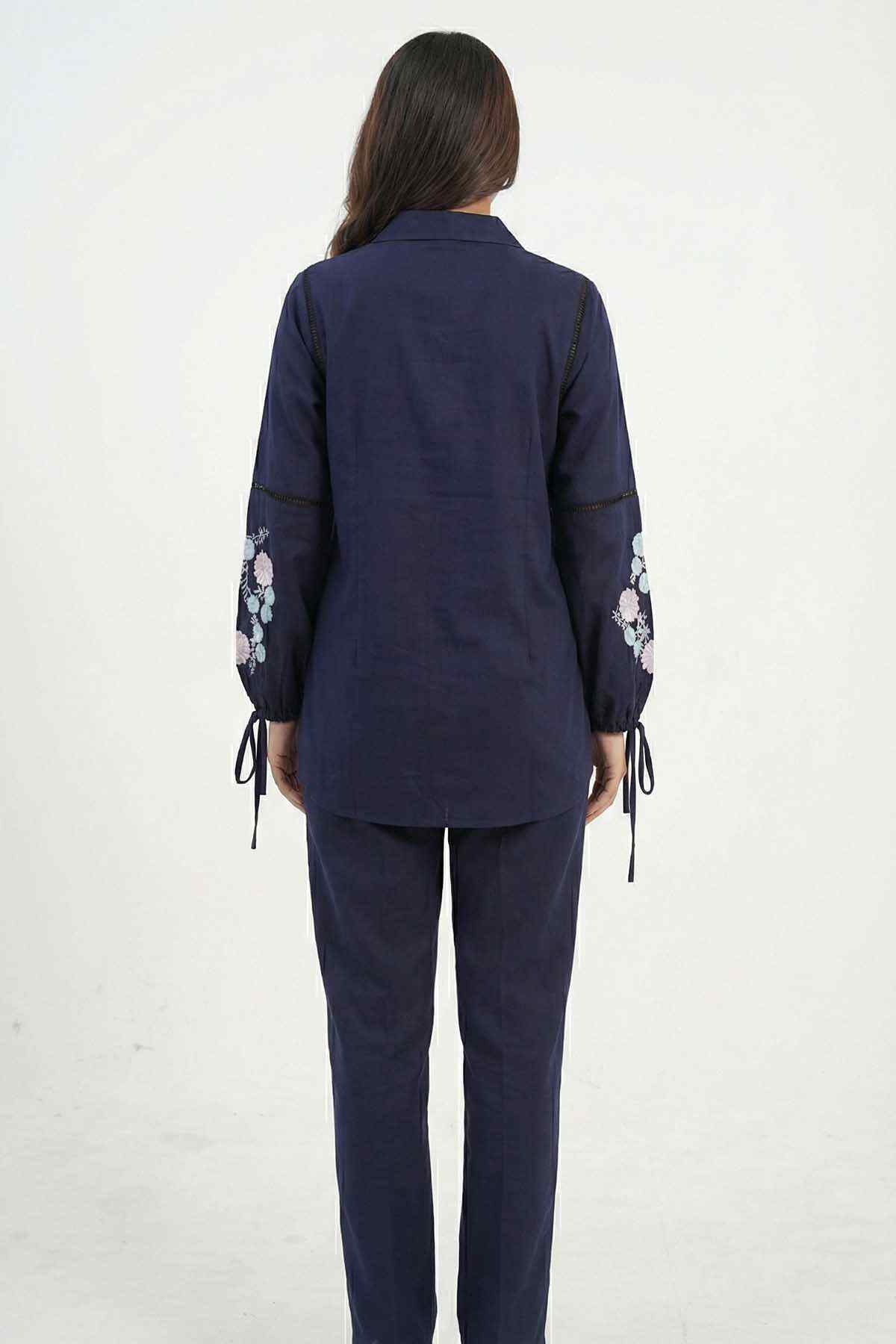 Navy blue tunic shirt and pants set, back view with floral embroidered sleeve cuffs