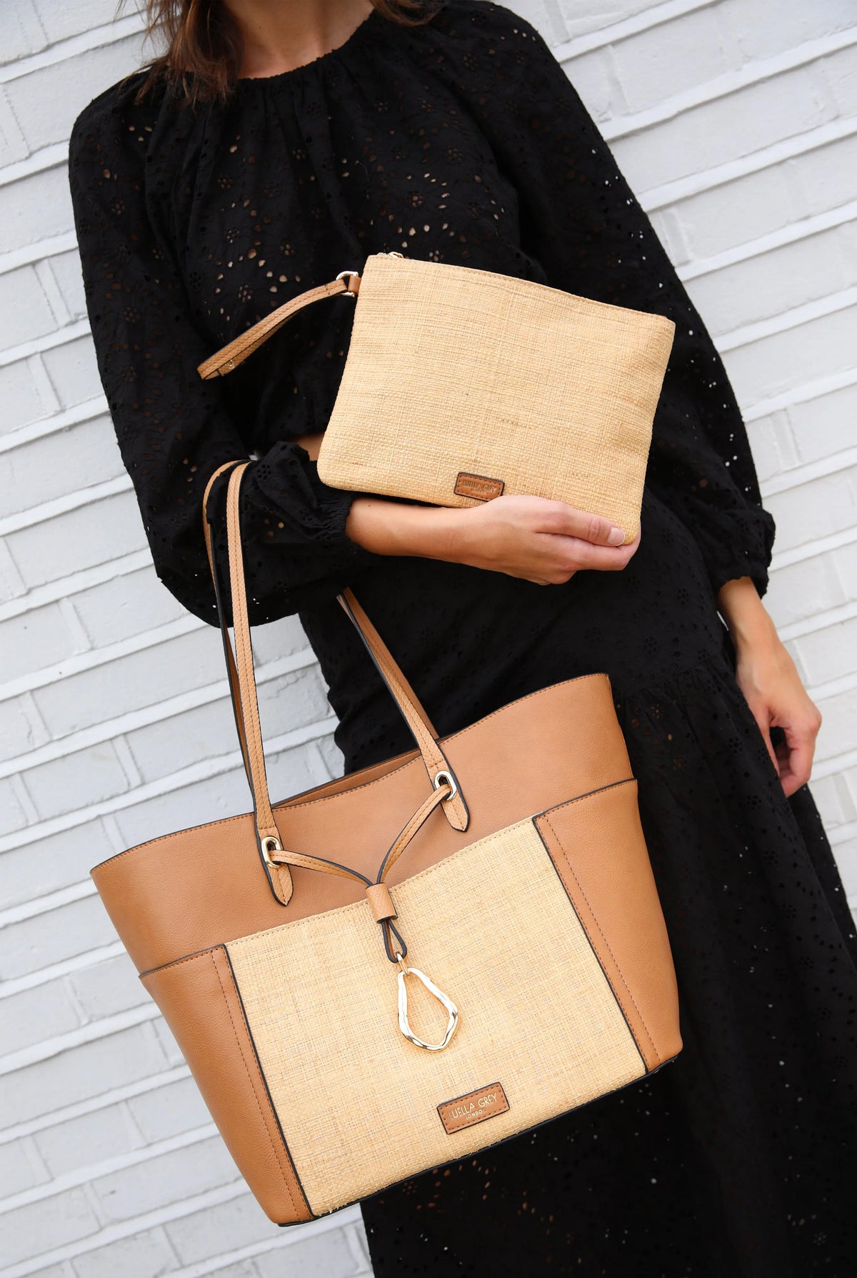 Tan woven tote bag with brown leather trim and matching woven zip pouch