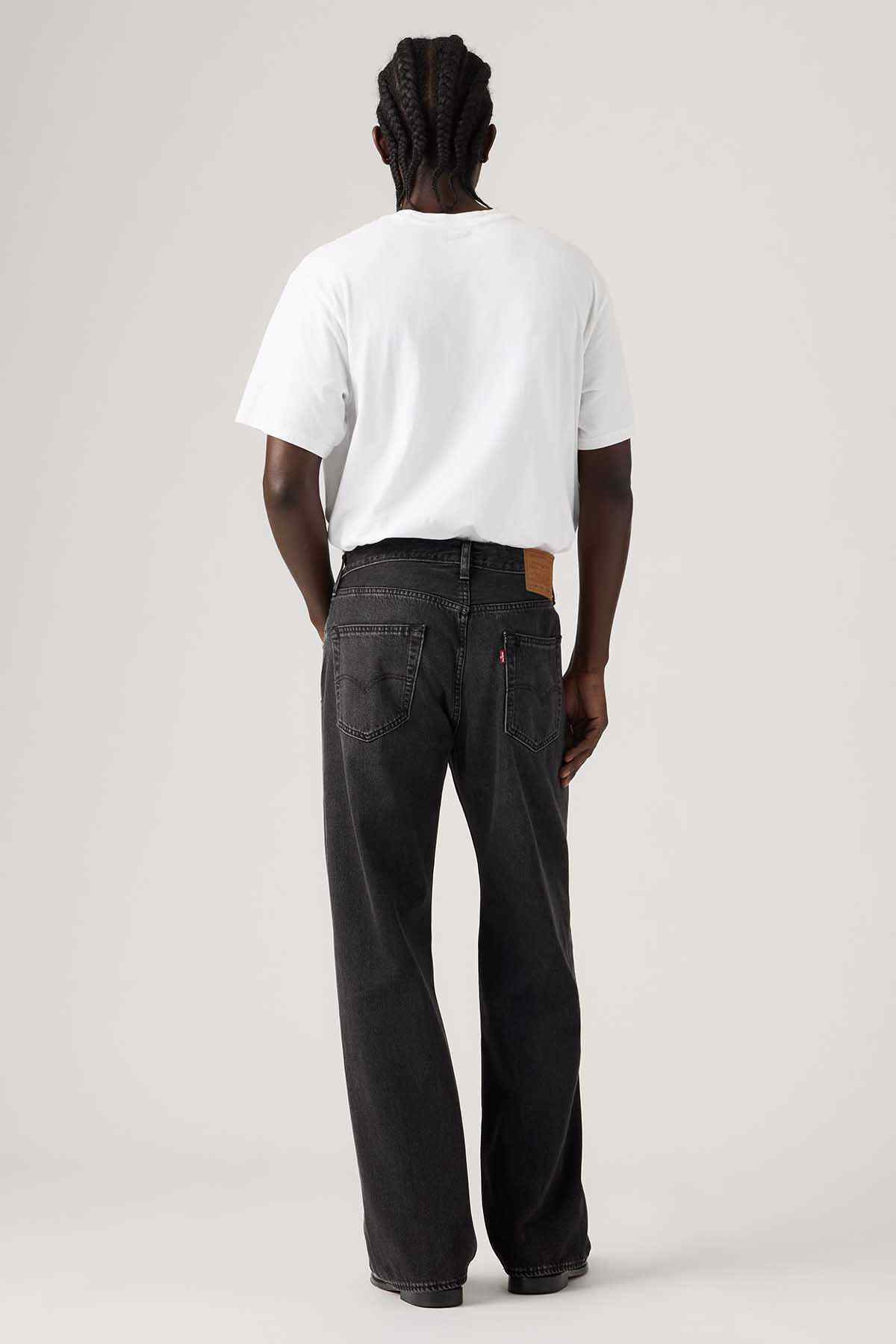 Black denim jeans back view with stitched pockets and belt loops