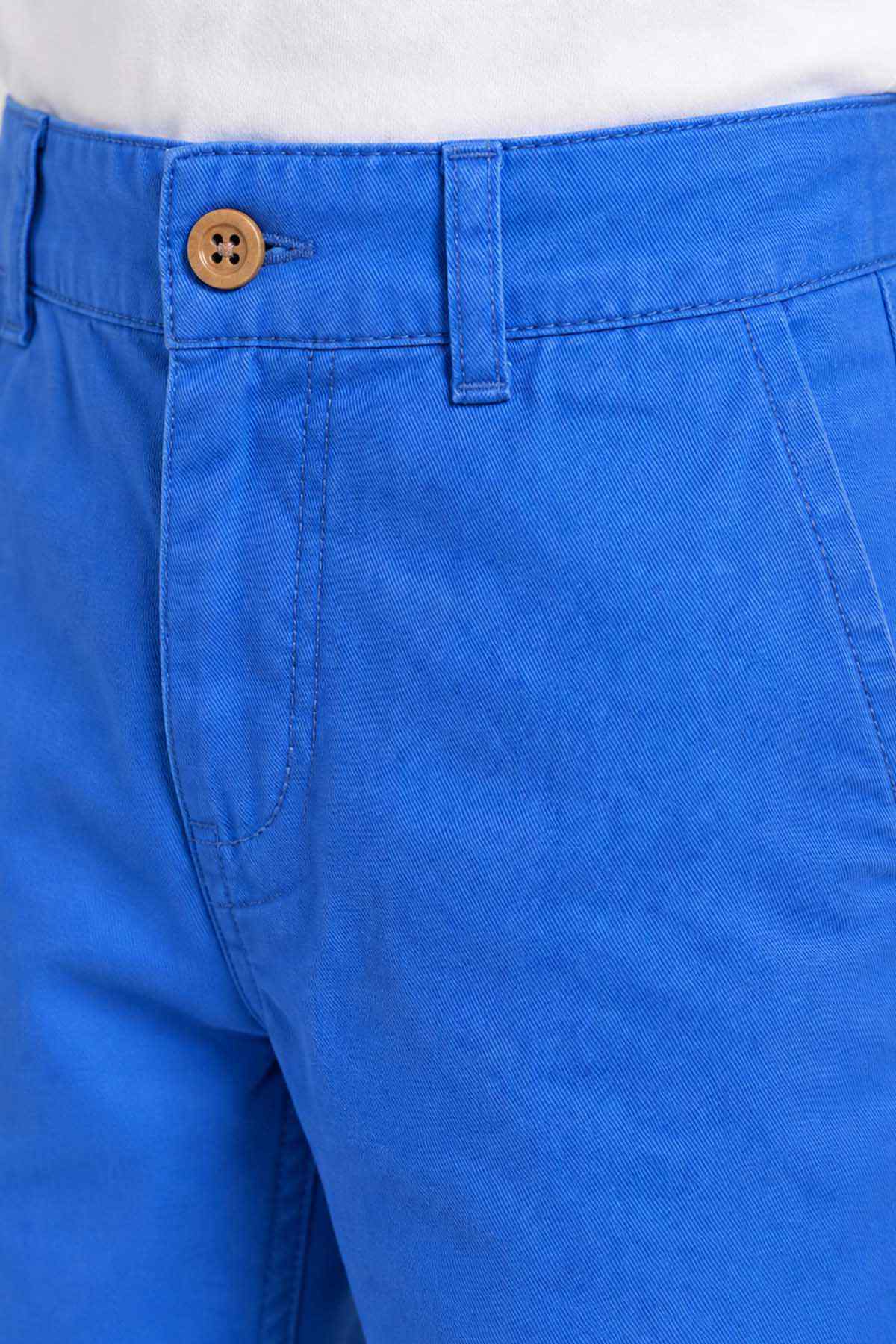 Blue denim pants with brown button and stitched waistband detail.