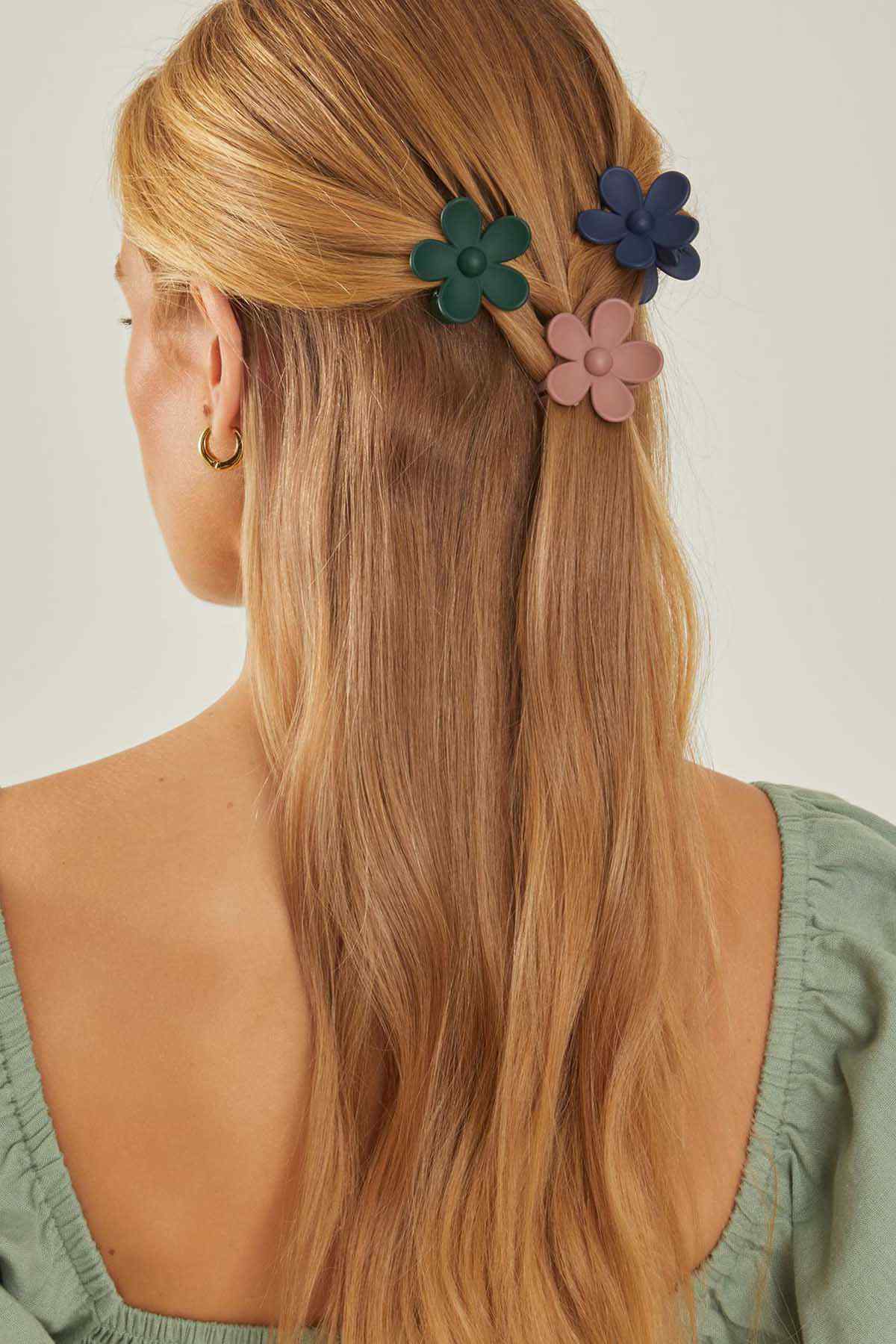 Flower hair clips in dark tones, three multi-color blooms on a ponytail