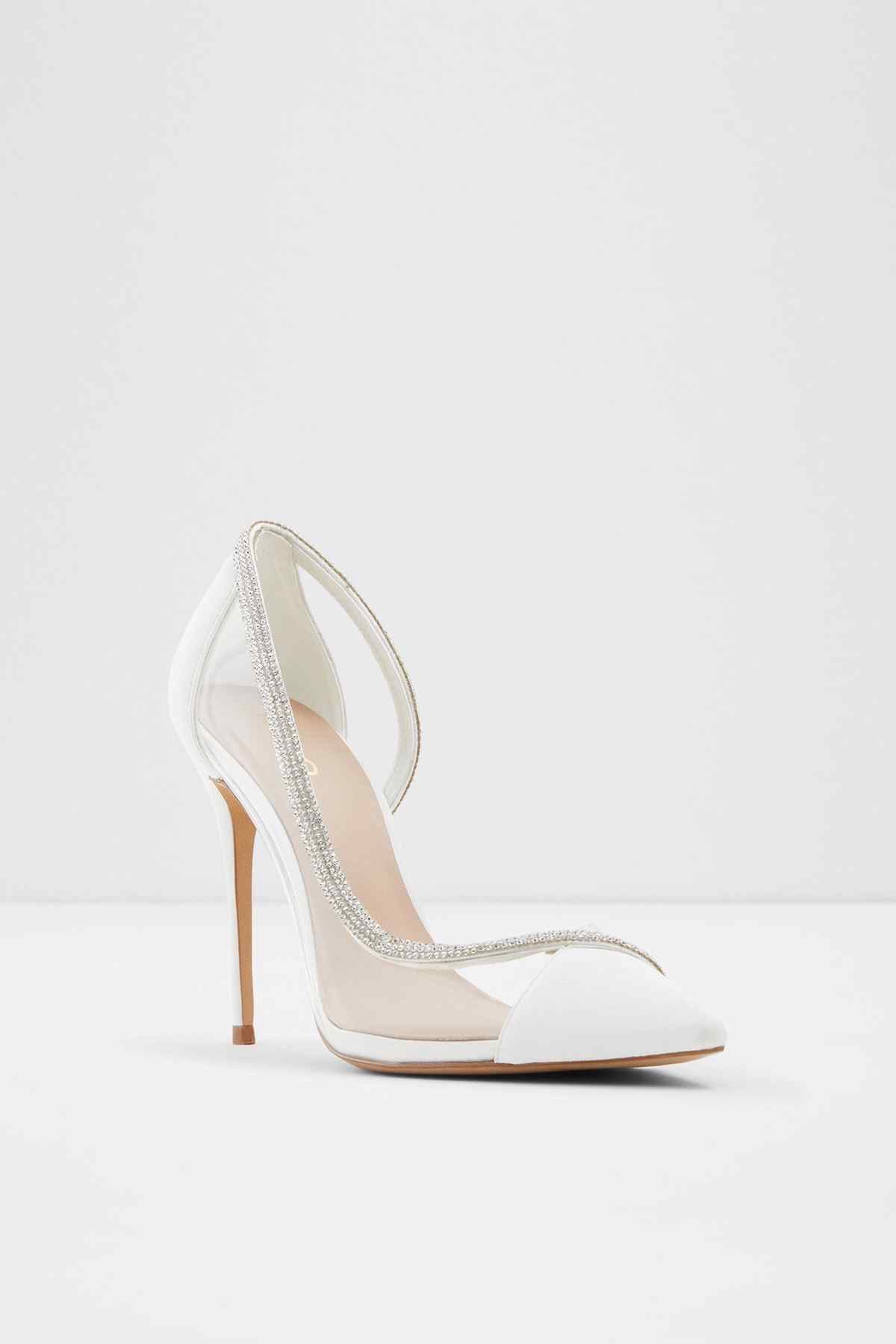 White pointed-toe stiletto pumps with rhinestone slingback strap, heel view
