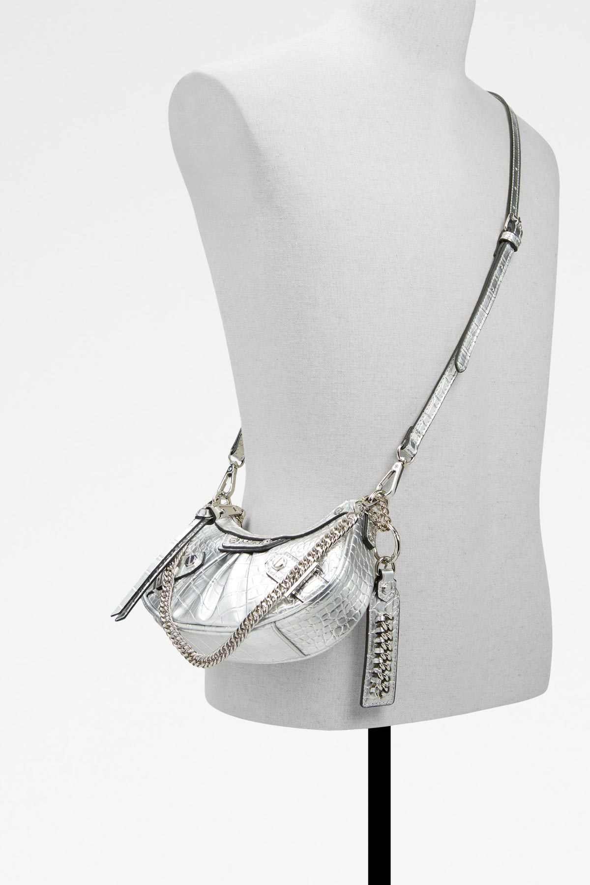 ALDO silver chain-strap shoulder bag on mannequin, textured finish, zip top, key tag