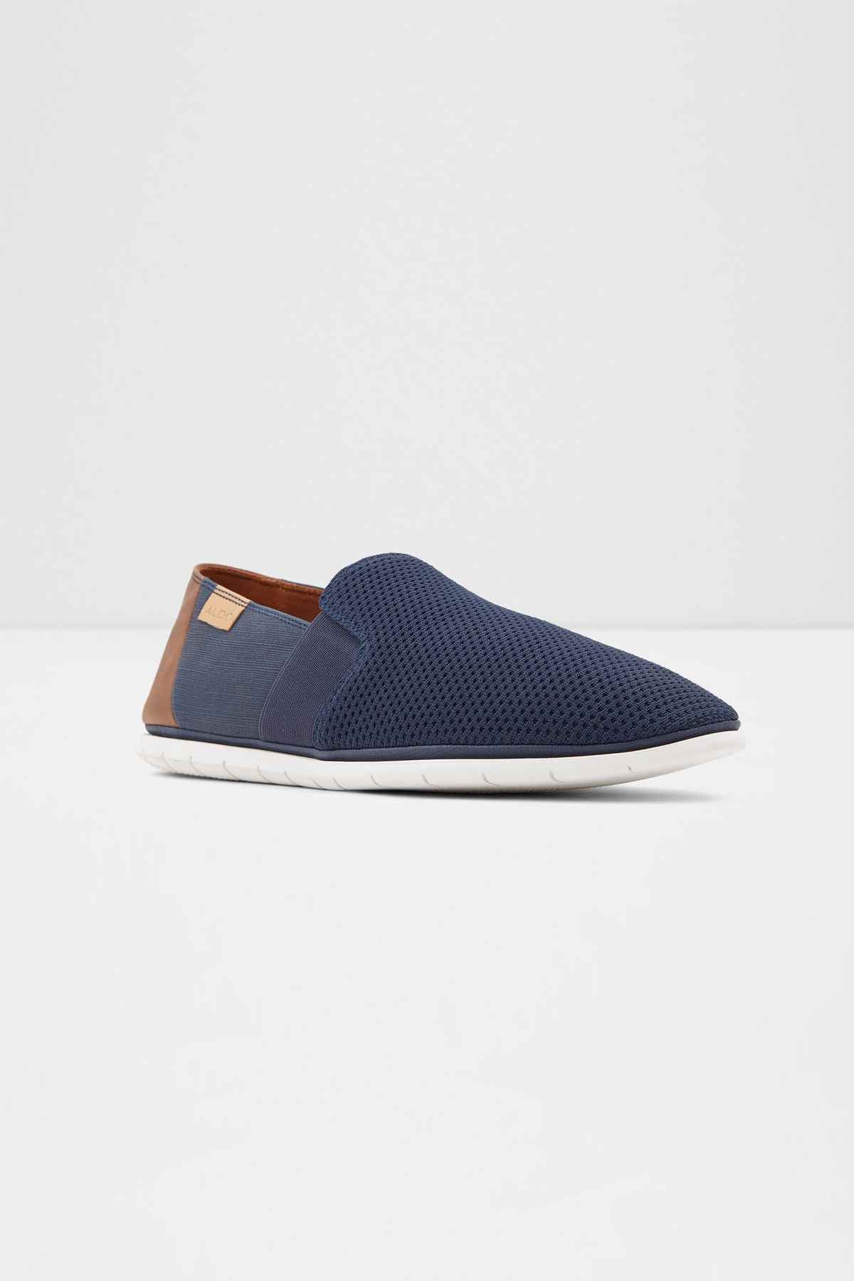 ALDO navy slip-on shoe with tan lining, perforated upper, white rubber sole