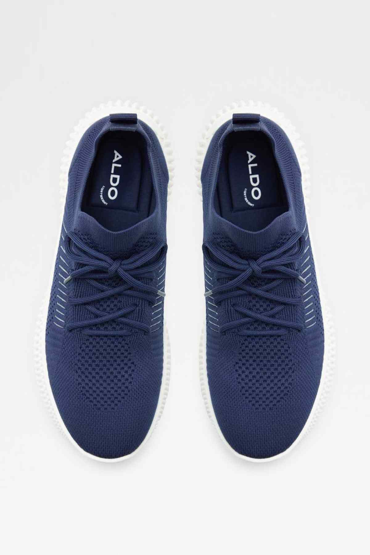Navy lace-up knit sneakers with ALDO logo on tongue and white rubber sole