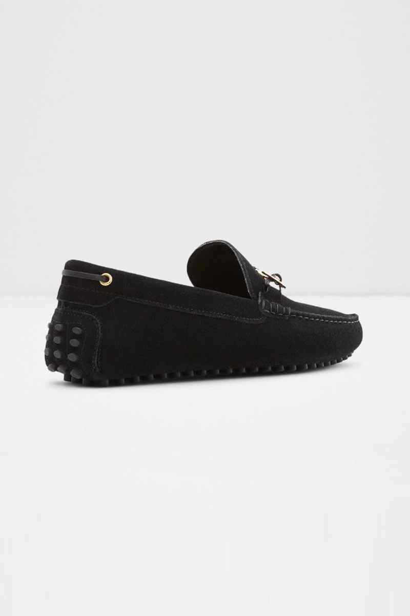 Black loafer with perforated side panel and gold-tone metal accents