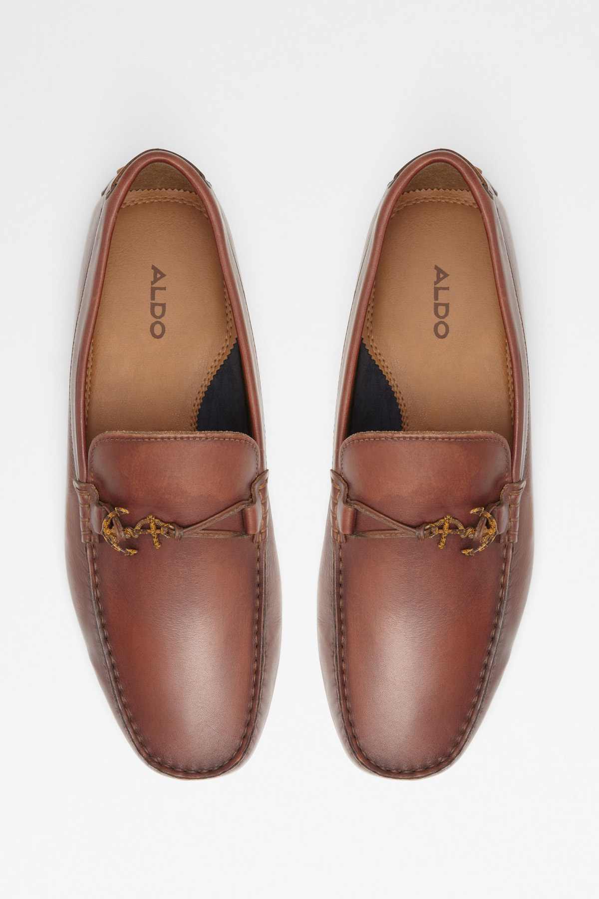 Cognac leather loafers with gold-tone metal ornament, pair view