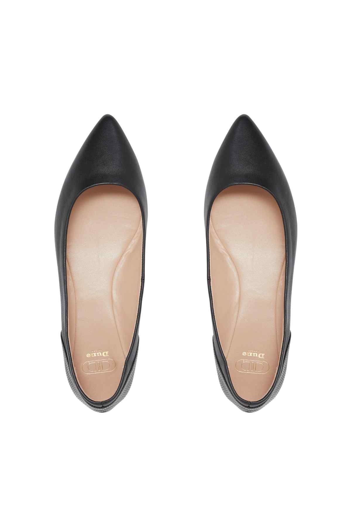 Black leather ballet flats, front view, pointed-oval toe with stitched trim
