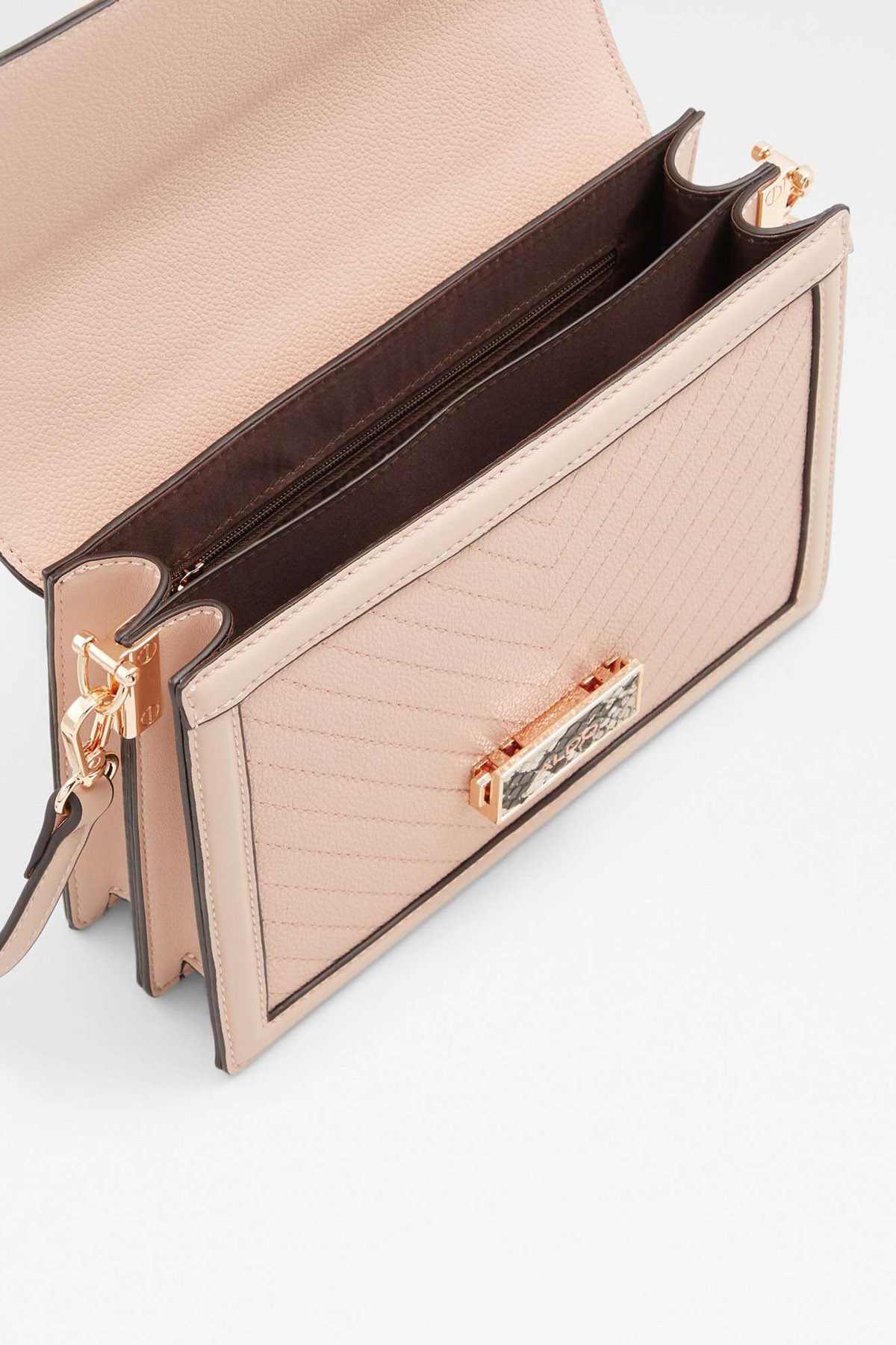 ALDO light pink crossbody bag interior with zip pocket and card slot, gold trim