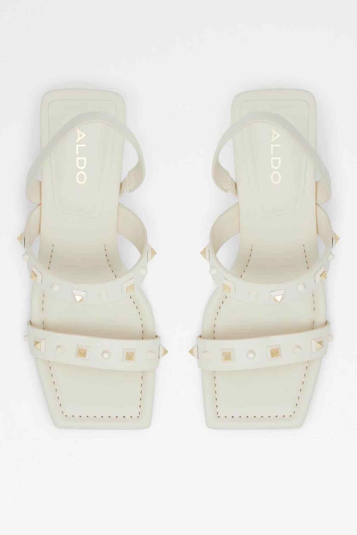 Pair of white heeled sandals, open toe with gold-tone studs on ankle and toe straps