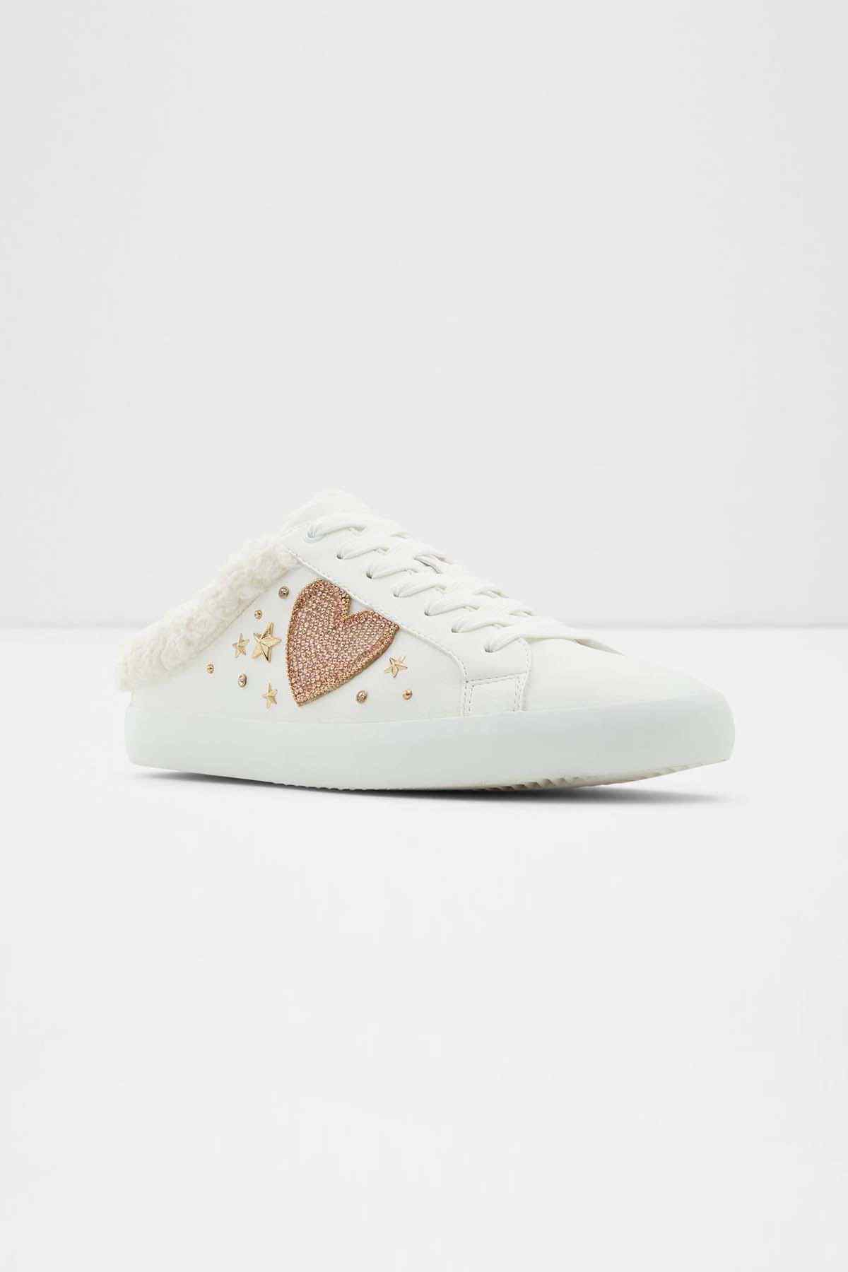 ALDO white slip-on sneaker with heart patch, star details, and lace-up front