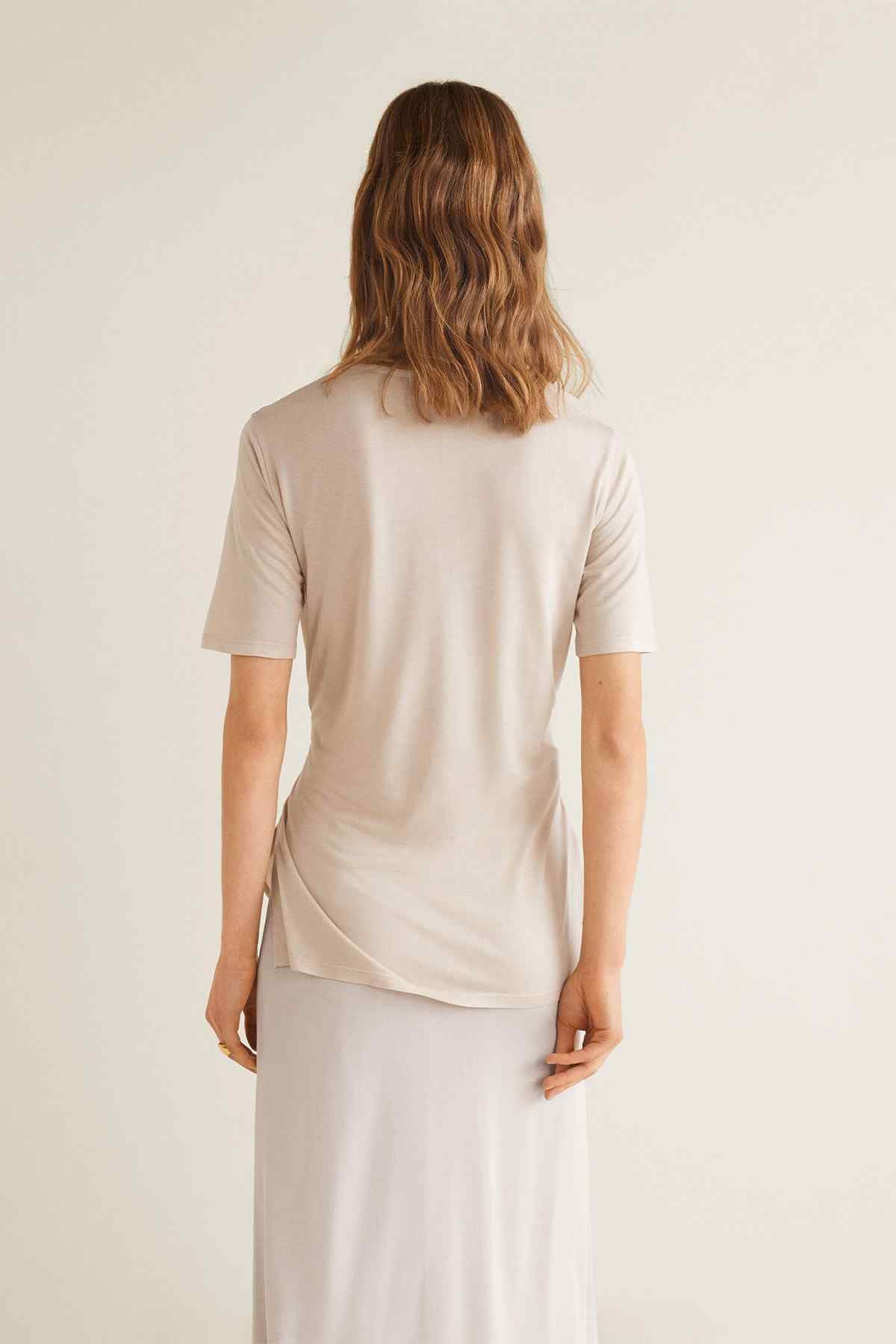 Light grey short-sleeve top with waist tie, back view