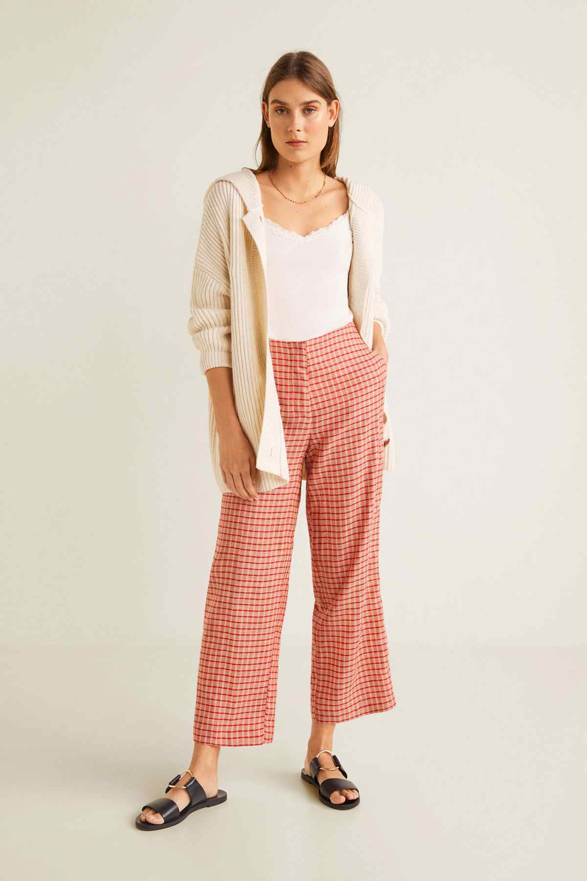 MANGO red checkered wide-leg trousers with cream cardigan, front view