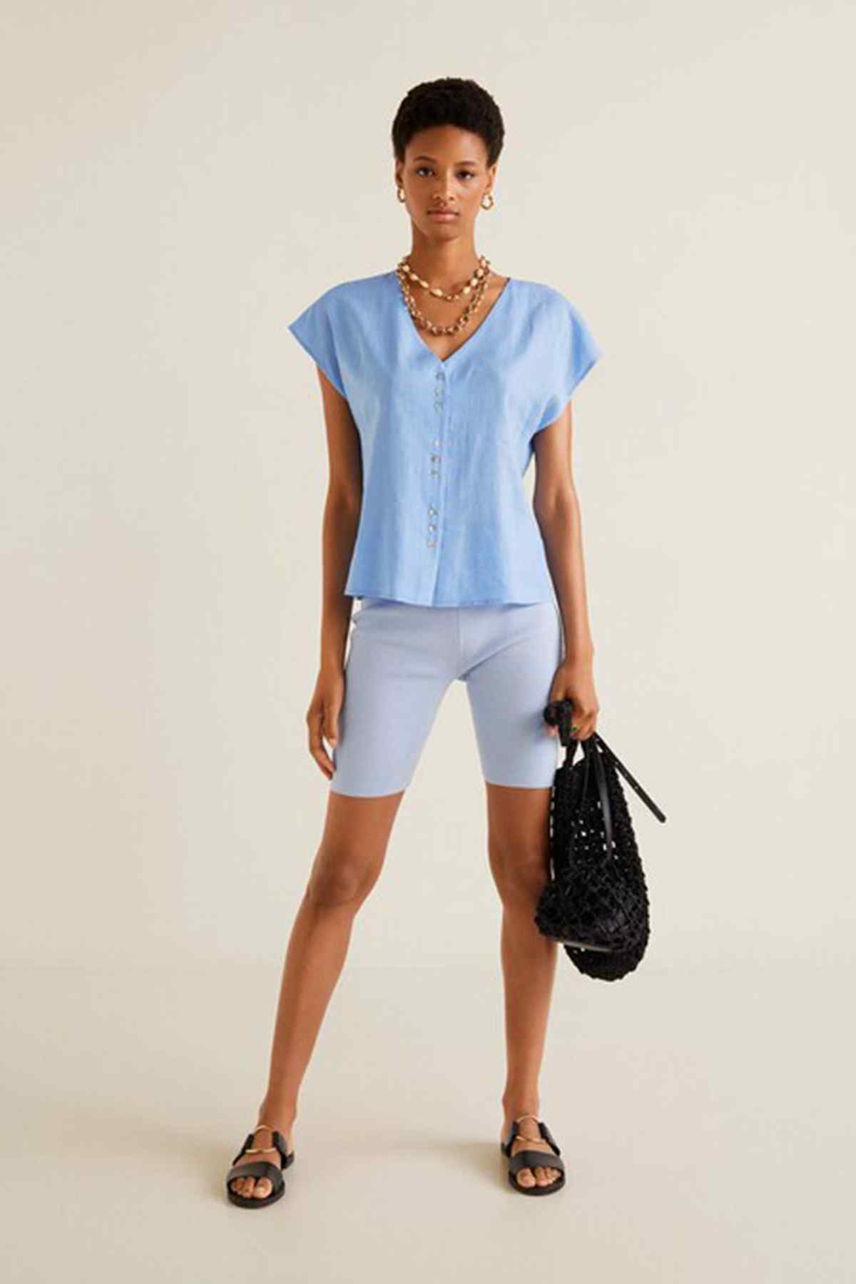 Light blue V-neck blouse and matching biker shorts set