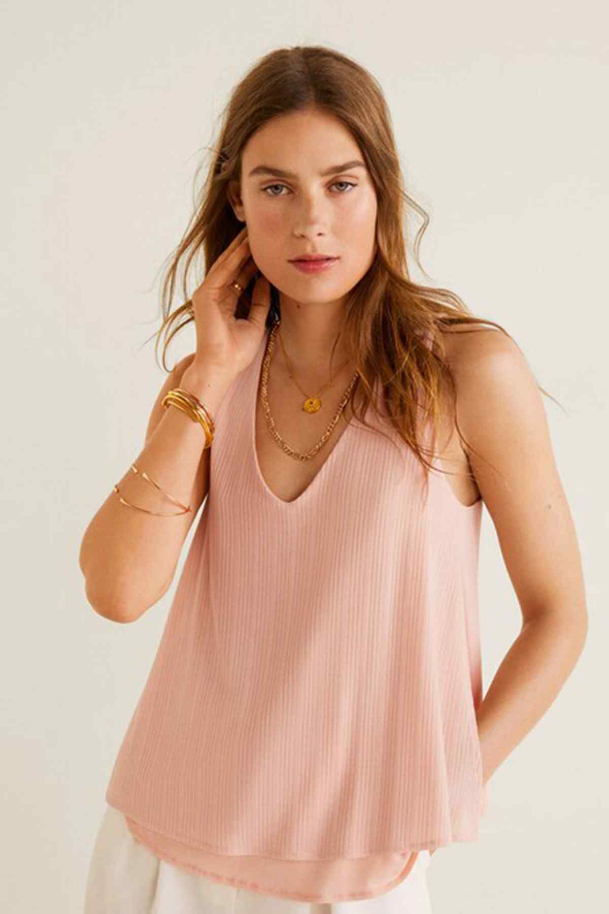 Sleeveless V-neck pink tank top with layered hem