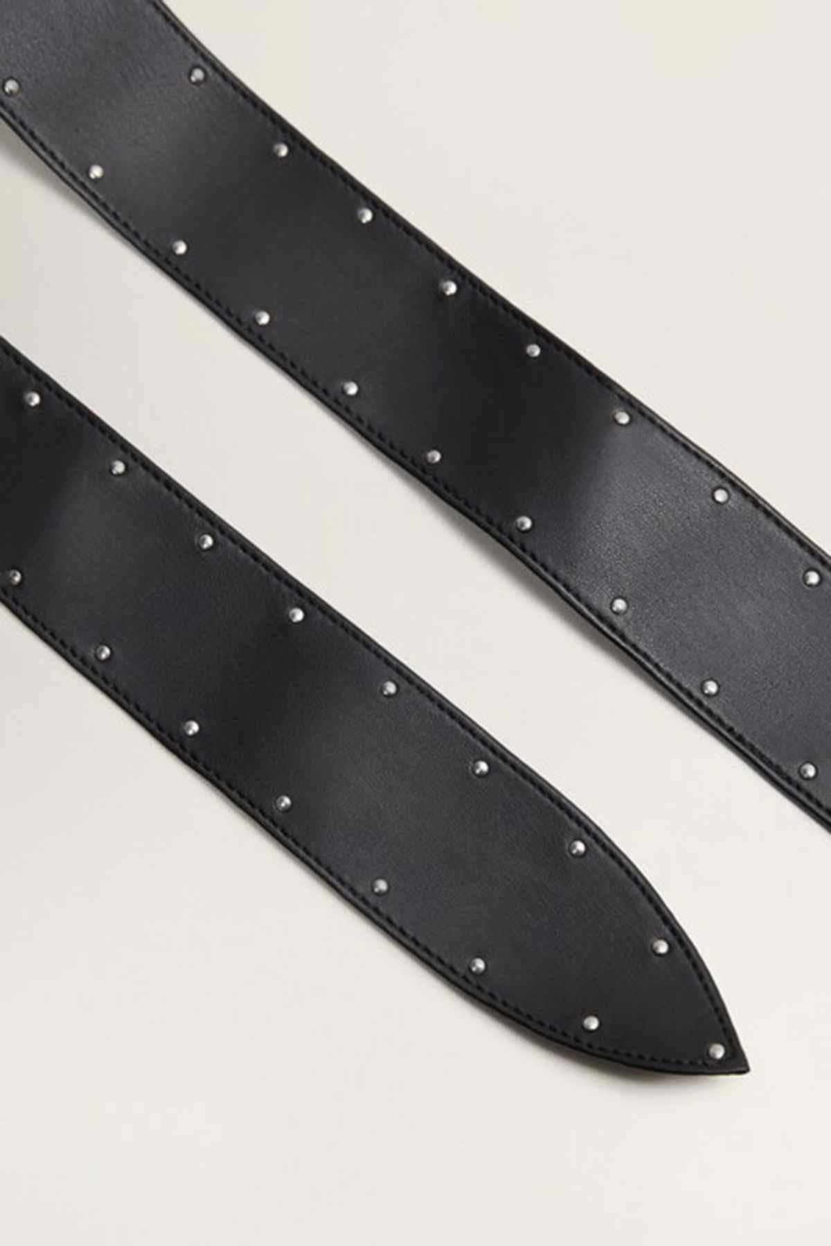 Black studded belt strap with evenly spaced metal rivets