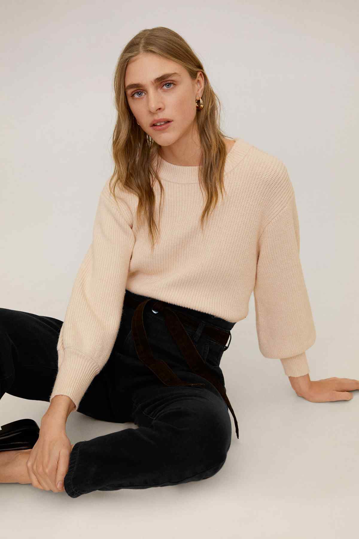MANGO beige knit sweater with black high-rise jeans and waist tie belt