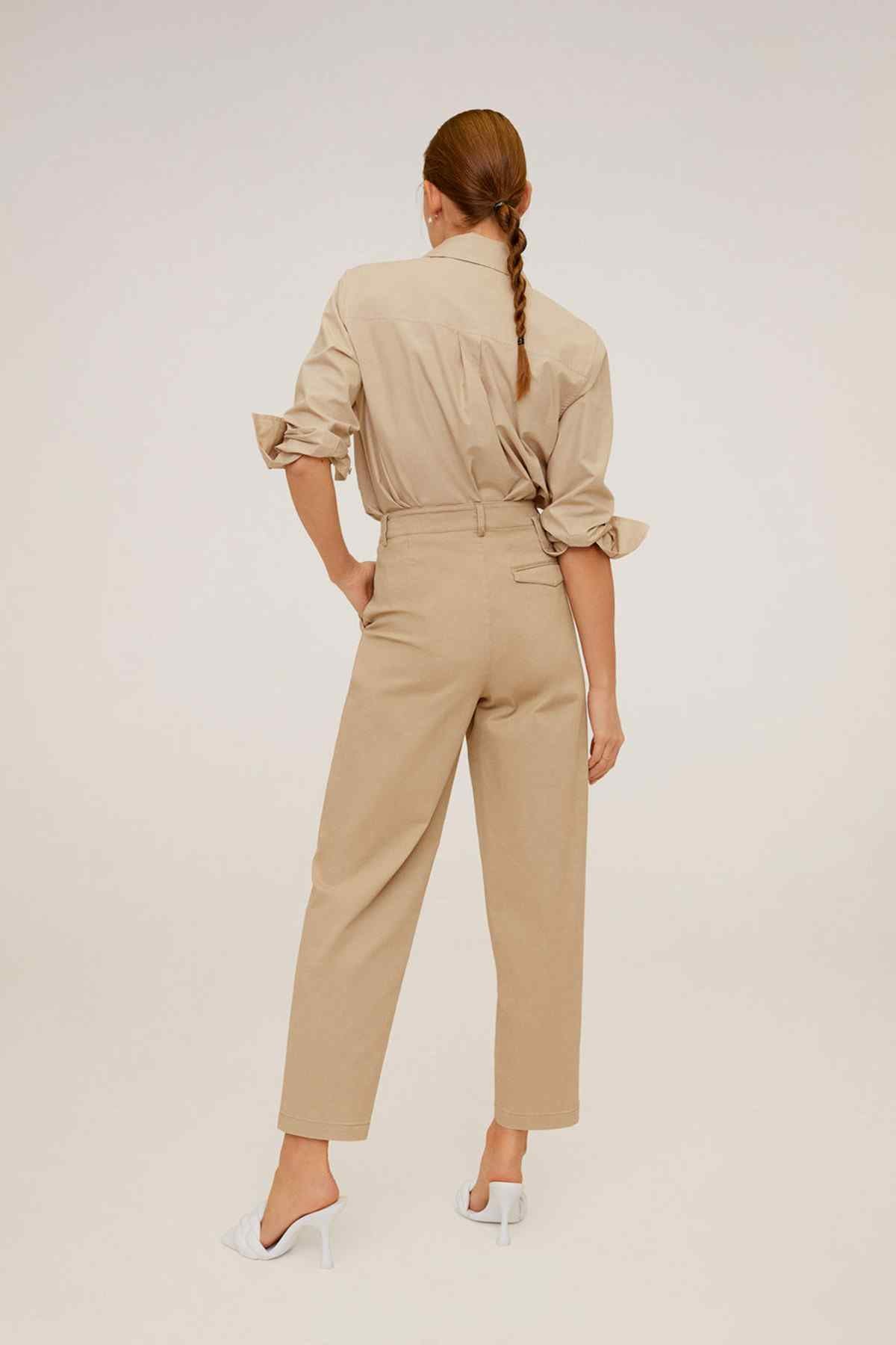 Women's tan high-rise trousers, back view, belt loops and tapered ankle cuffs