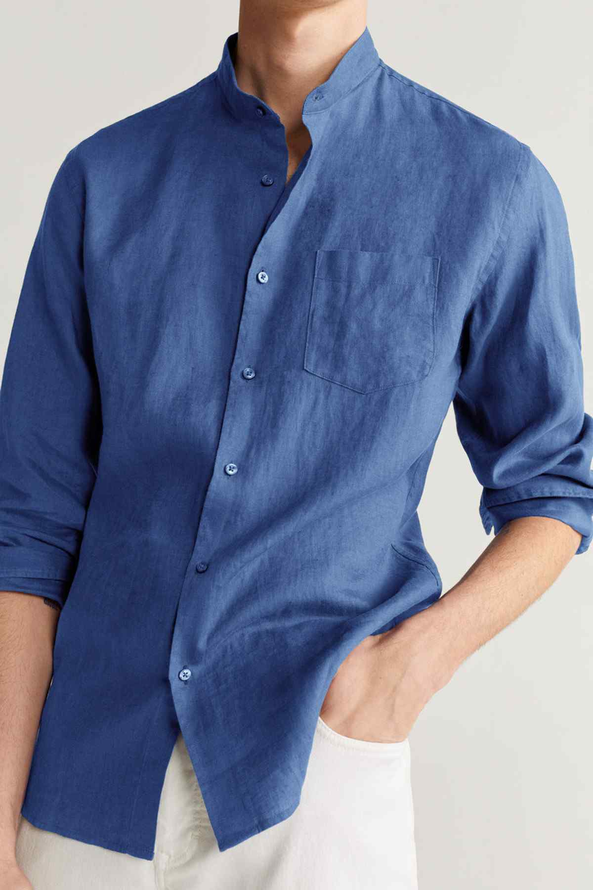 Men's navy button-up shirt with chest pocket and buttoned collar
