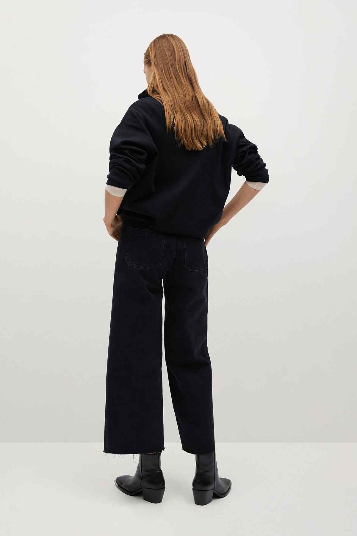 Black denim jacket, back view, zip front and cropped length